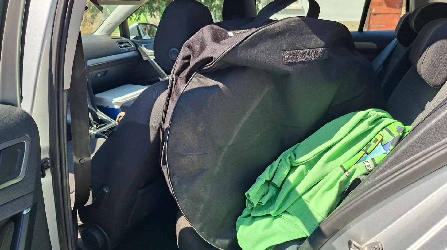 Spare wheel stored on the rear passenger seat during our VW Golf Estate travel setup test.