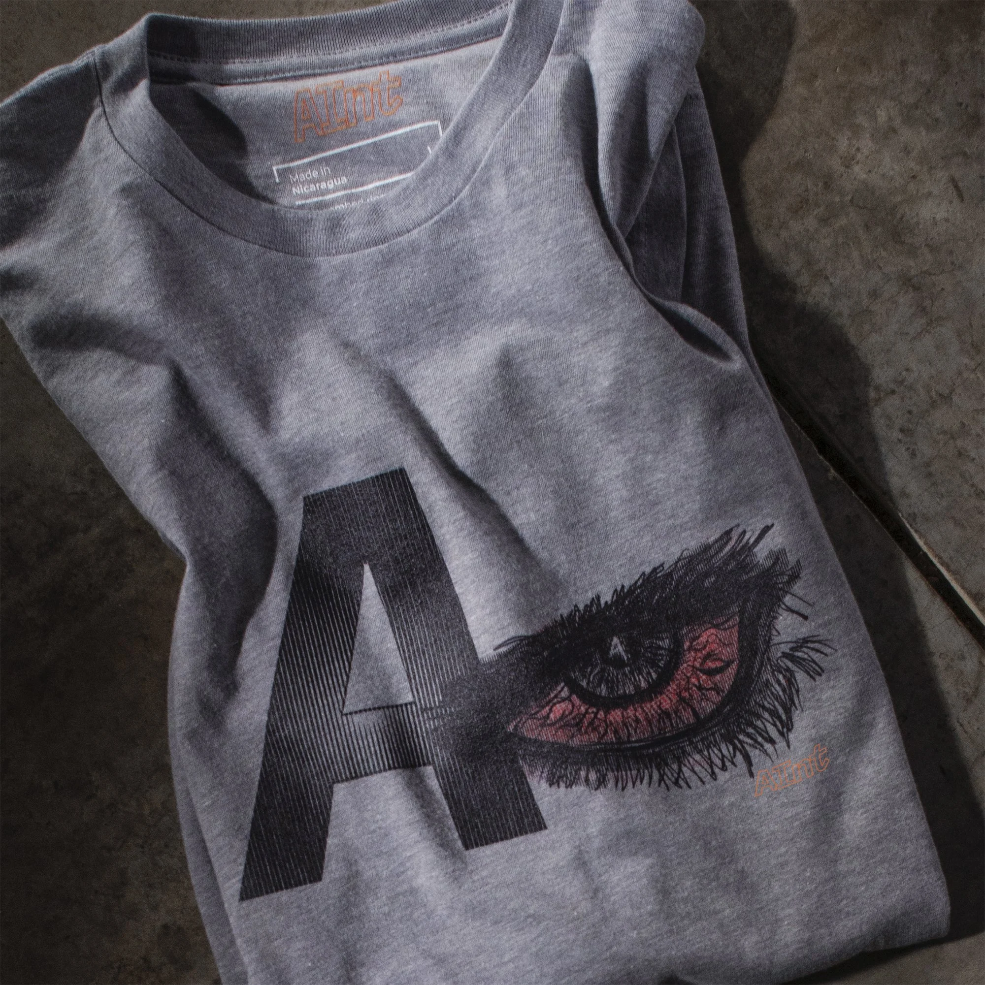 AInt-A-Eye-T-shirt-folded-on-studio-floor.jpg
