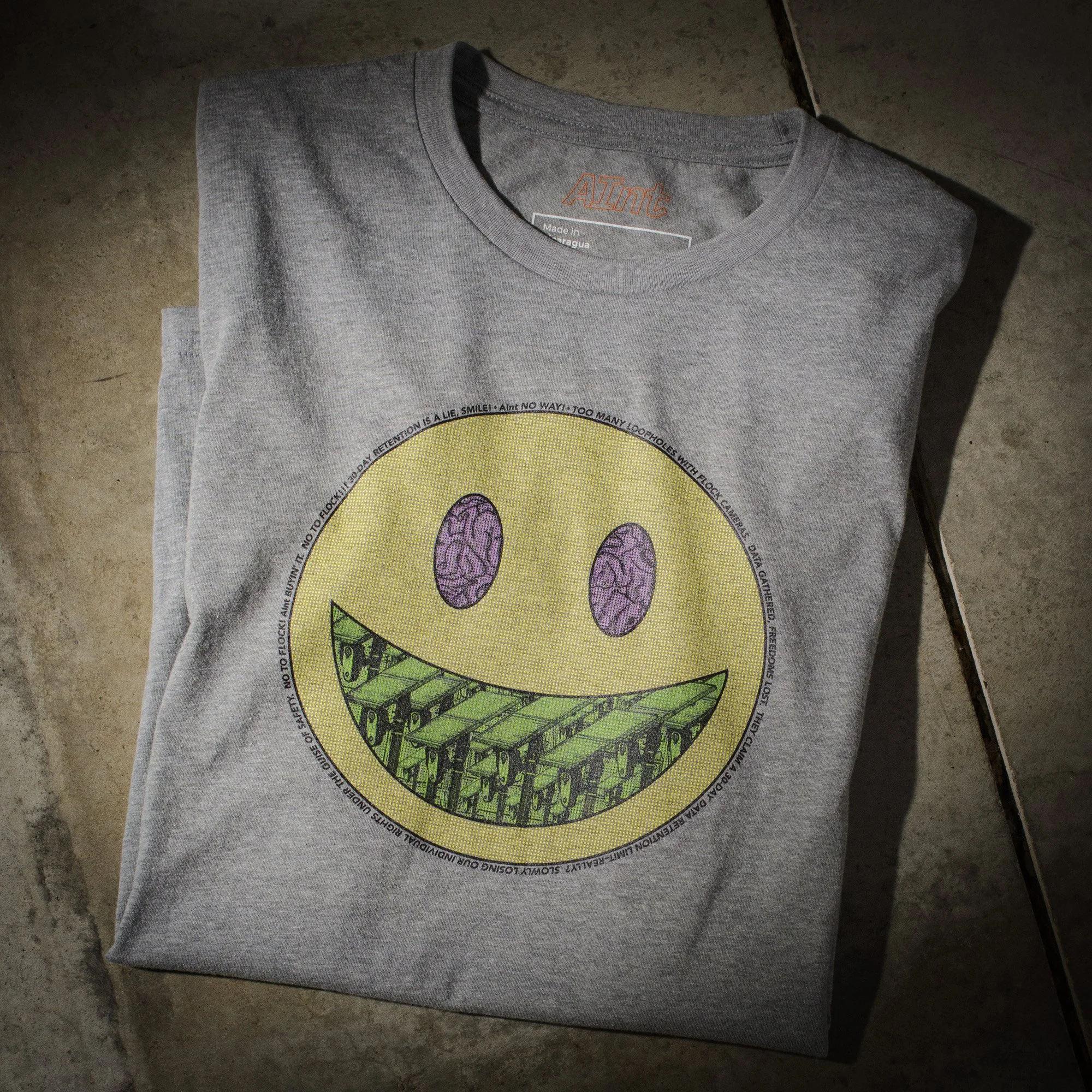 AInt-smiley-next-level-6210-t-shirt-flock-camera-protest-studio-product-photo.jpg