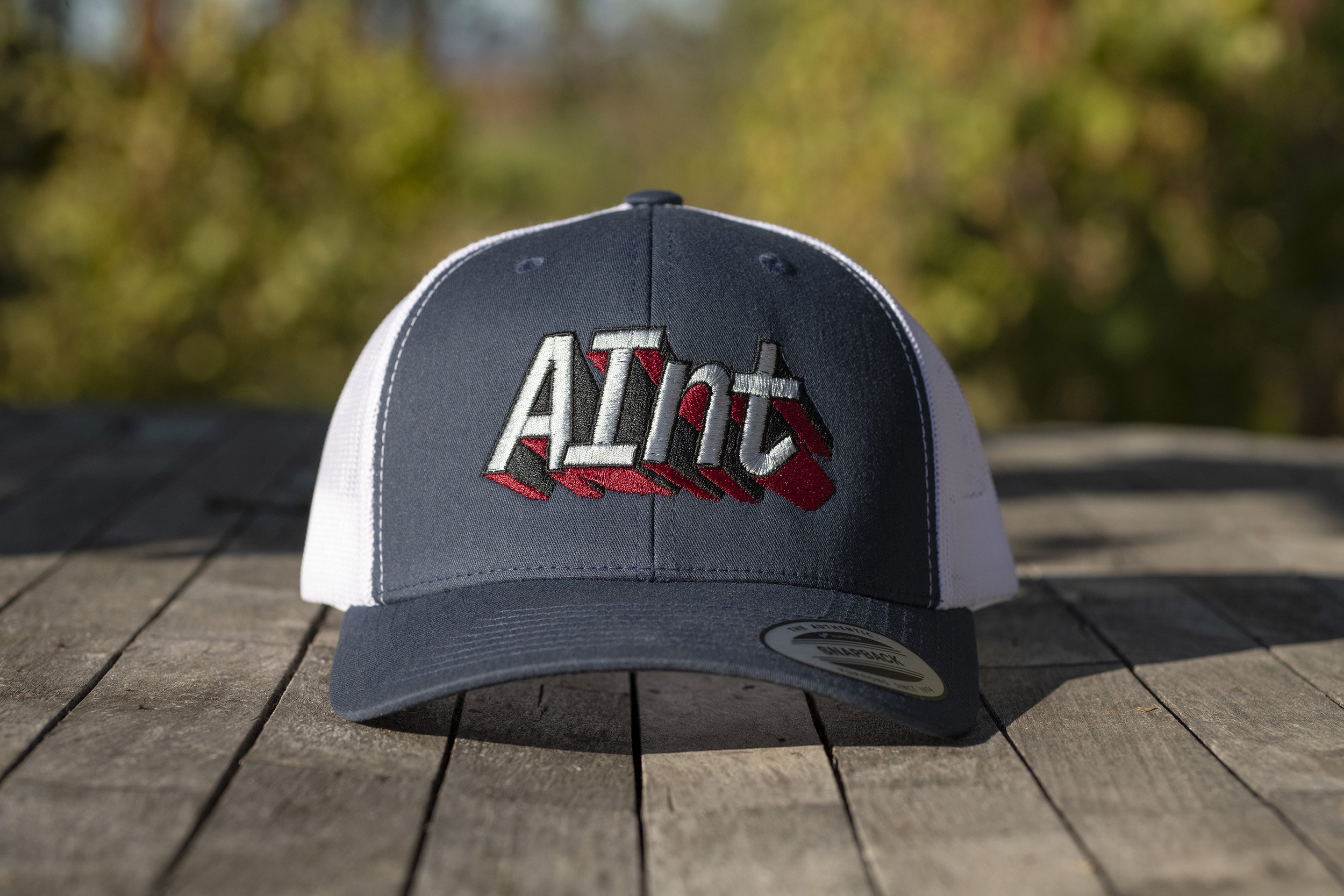 aint-embroidered-logo-yupoong-6606-retro-trucker-cap-front.jpg