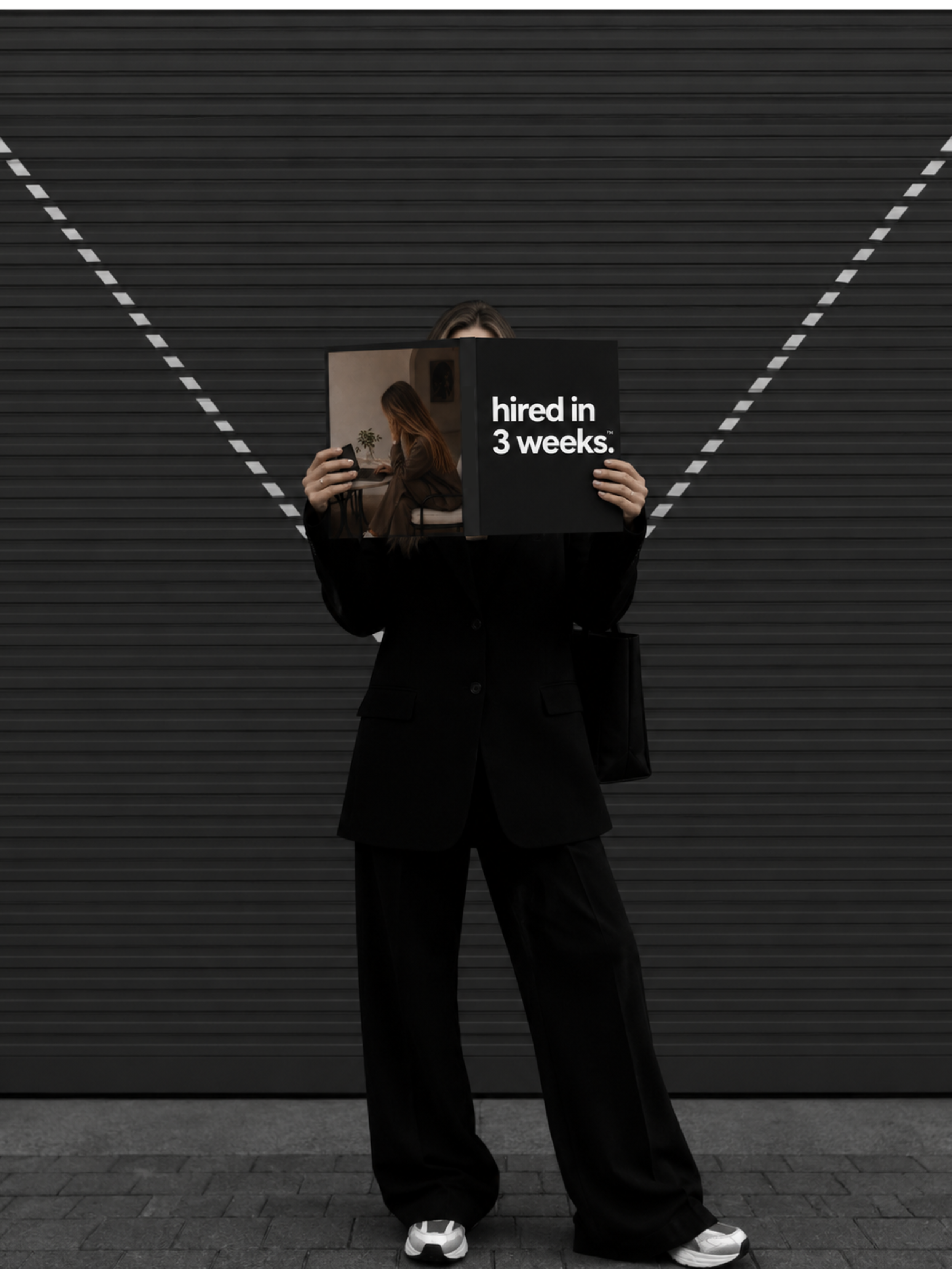 Woman holding a copy of the Hired in 3 Weeks framework