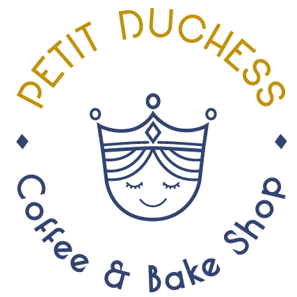 Logo for Petit Daughters Coffee & Bake Shop featuring a stylized crown with a smiling face and closed eyes, with the shop's name arched above and below.