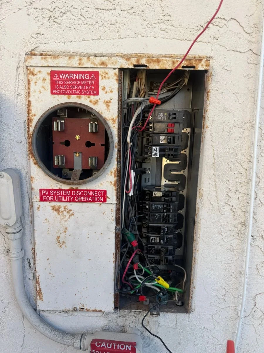 Old electrical panel being repaired in San Diego