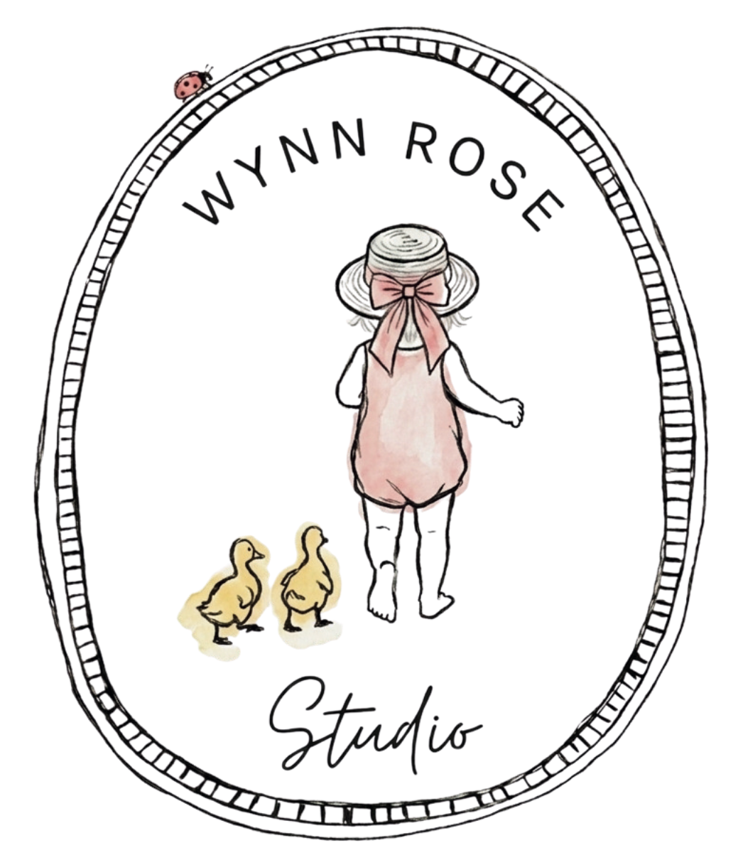 Illustration of a girl in a hat walking away, with two ducklings following behind, surrounded by an oval frame with the text 'Wynn Rose Studio' at the top and the word 'Studio' written at the bottom.