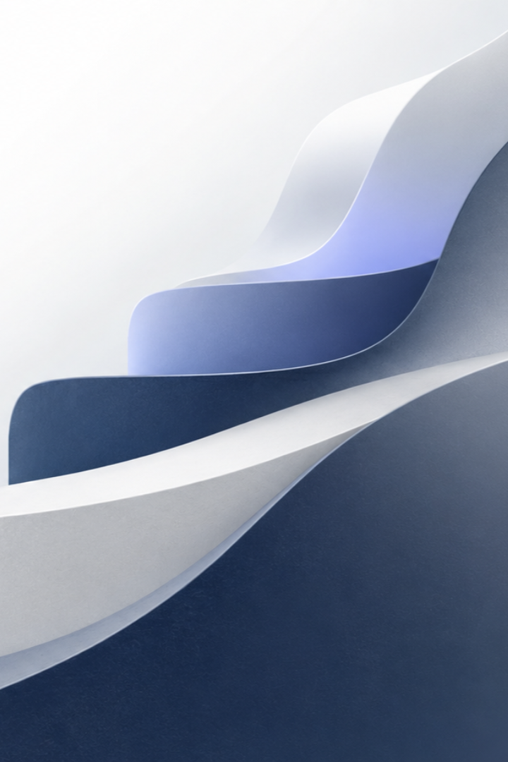 Abstract image of layered, curved paper or material in shades of white, blue, and gray.