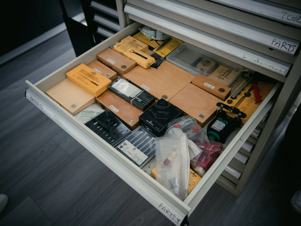 Organized parts drawers and watch service components at Meridian