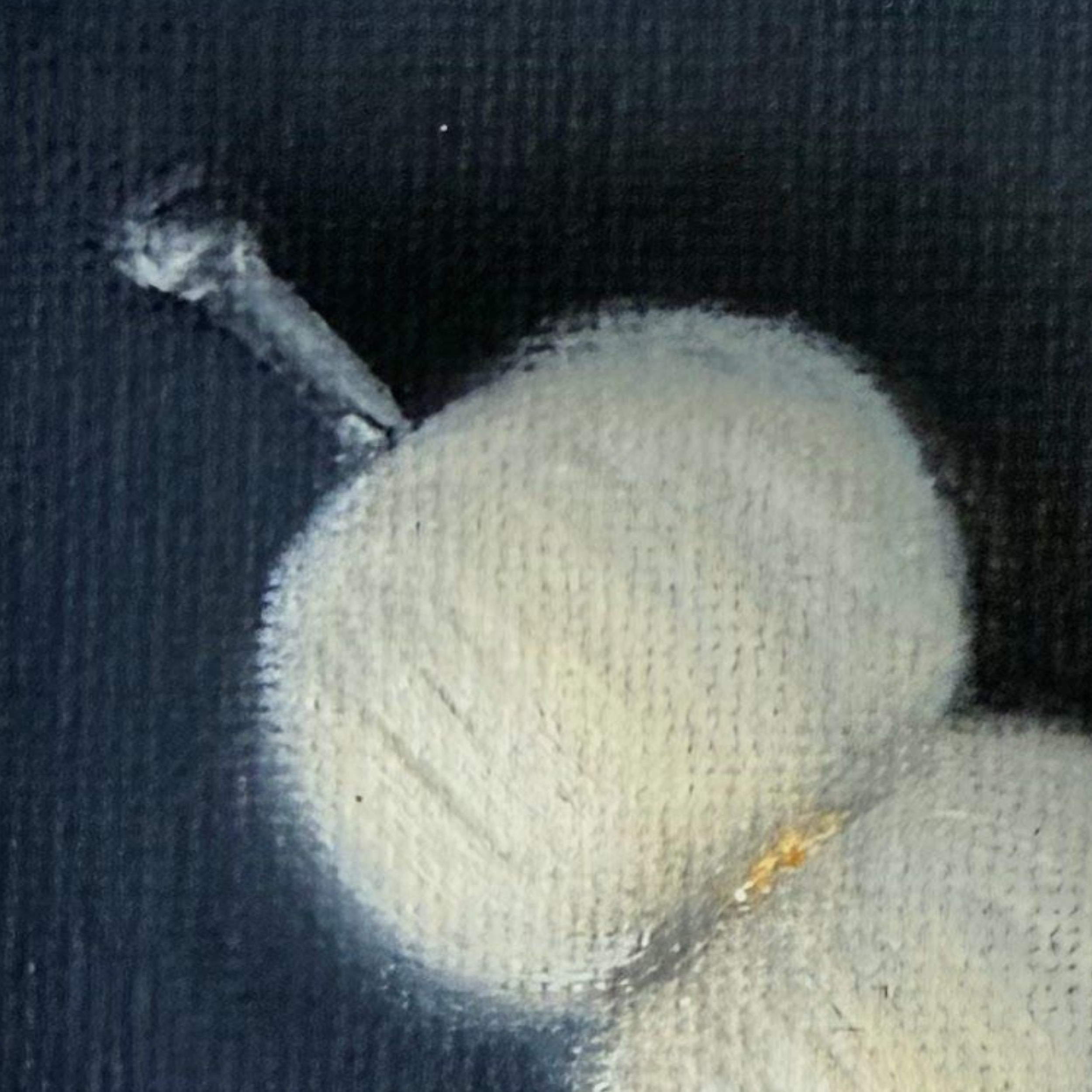 Close-up of a miniature cocktail garnish painting with soft white rounded forms, subtle shadows, small warm accents, and visible canvas texture.