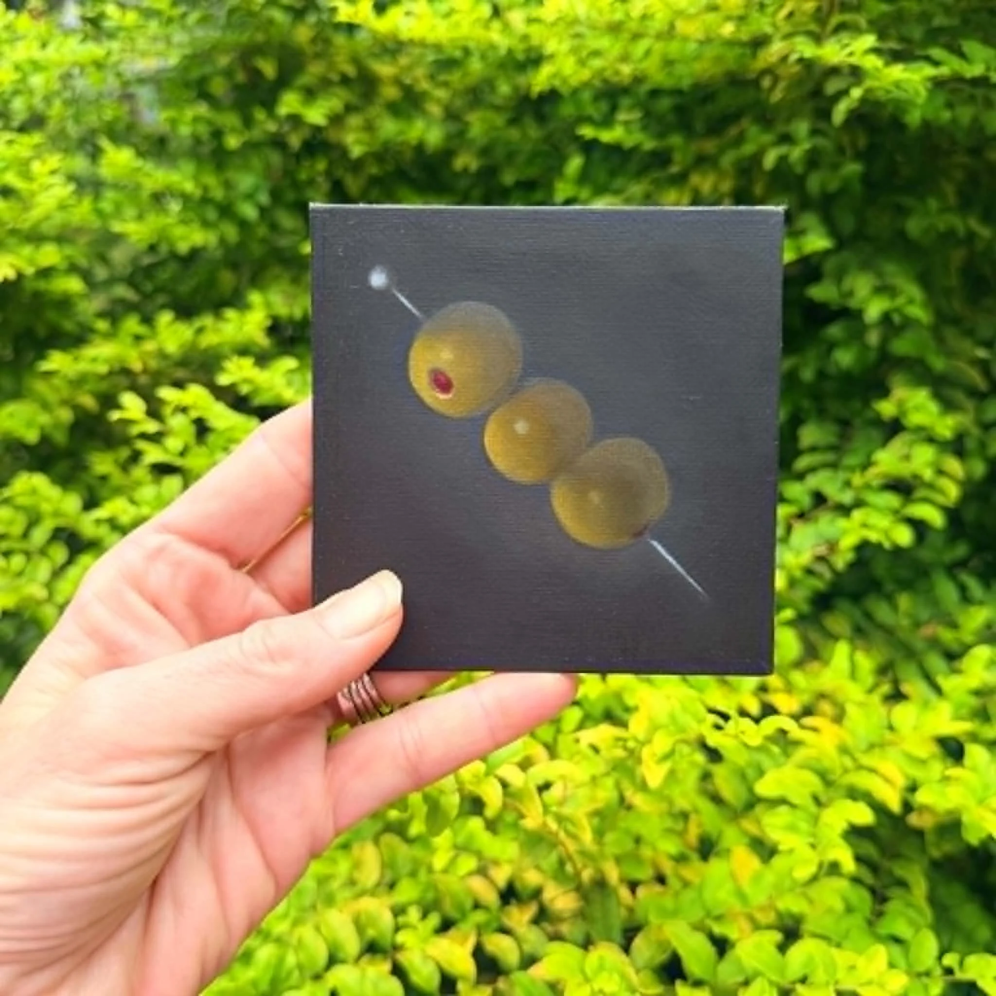 Small square olive oil painting shown on canvas board, ready to frame or display as part of a kitchen, bar, or dining room art grouping.