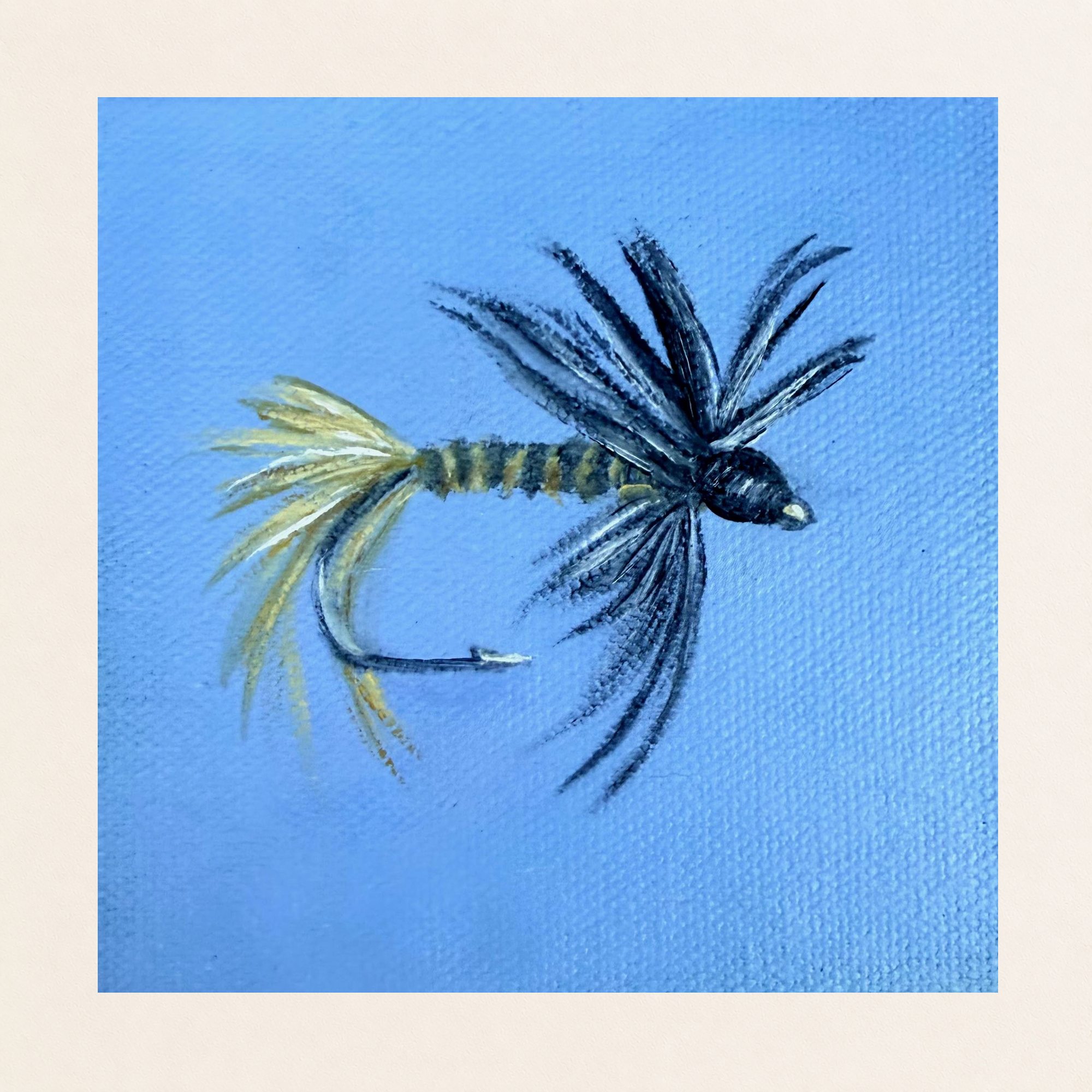 Original 4 x 4 inch oil painting of a black gnat fishing fly lure with dark hackle, pale tail fibers, and a curved hook against a clear blue textured background on canvas board.