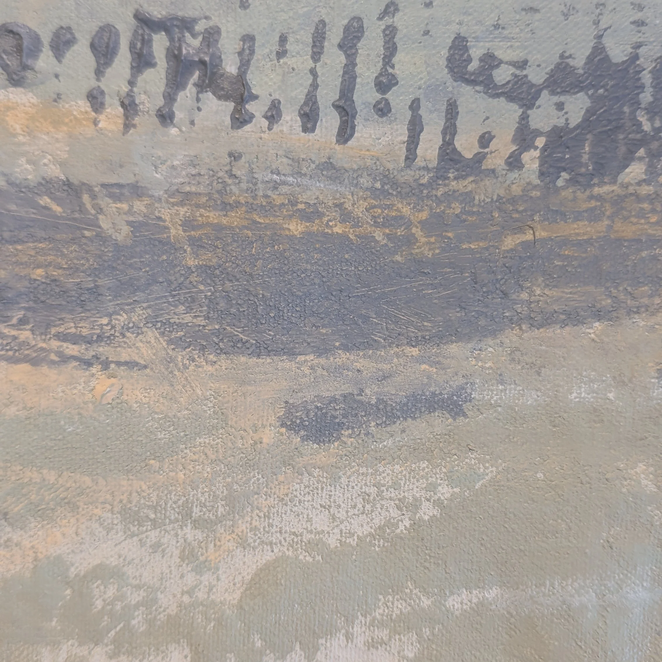 Close-up of textured acrylic paint with gray-blue, sand, warm white, charcoal marks, scraped texture, and layered canvas surface.