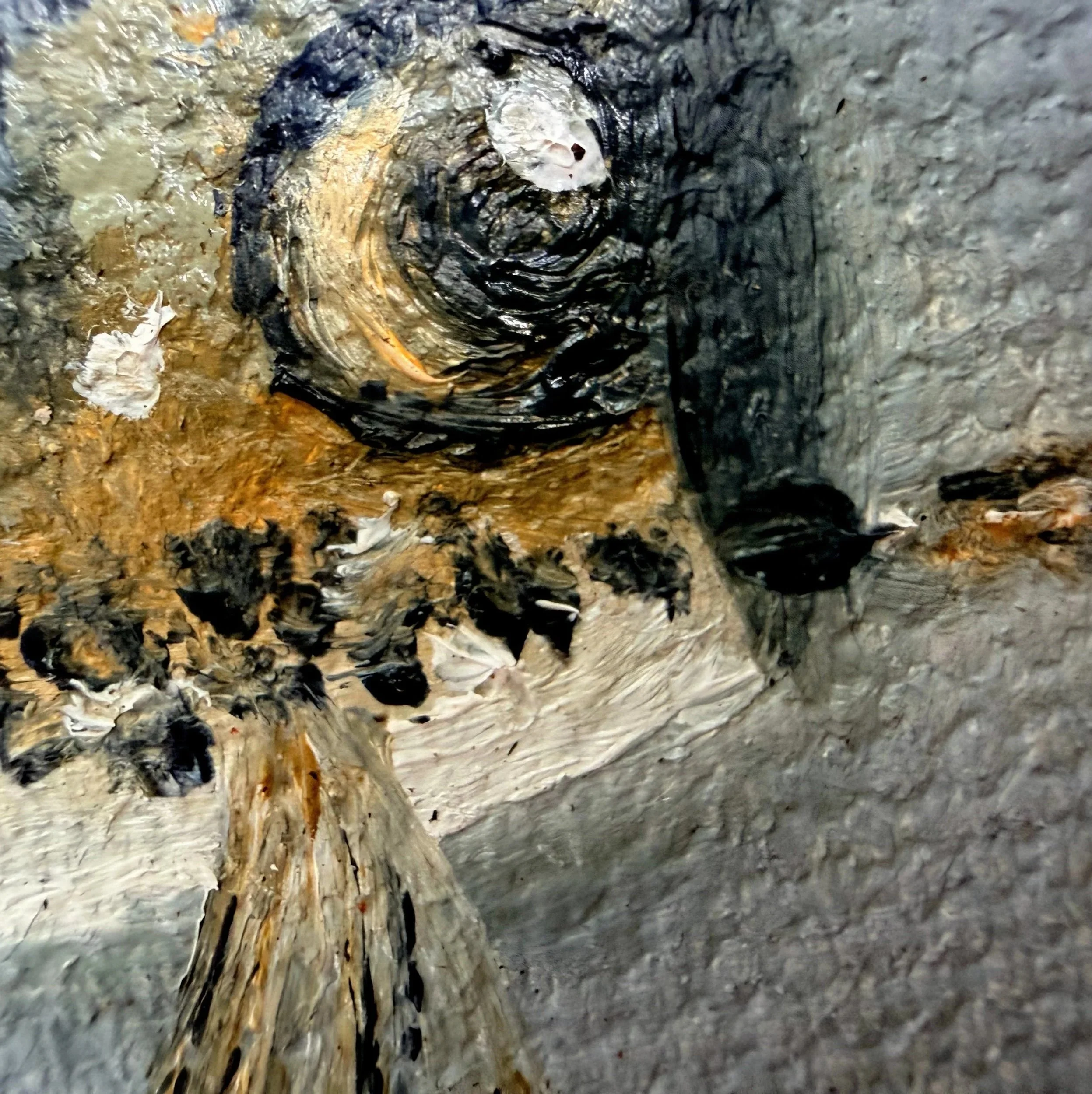 Close-up of a miniature fishing fly painted in oil with delicate feather-like brushwork, mottled brown and gold texture, hook detail, and visible canvas surface.