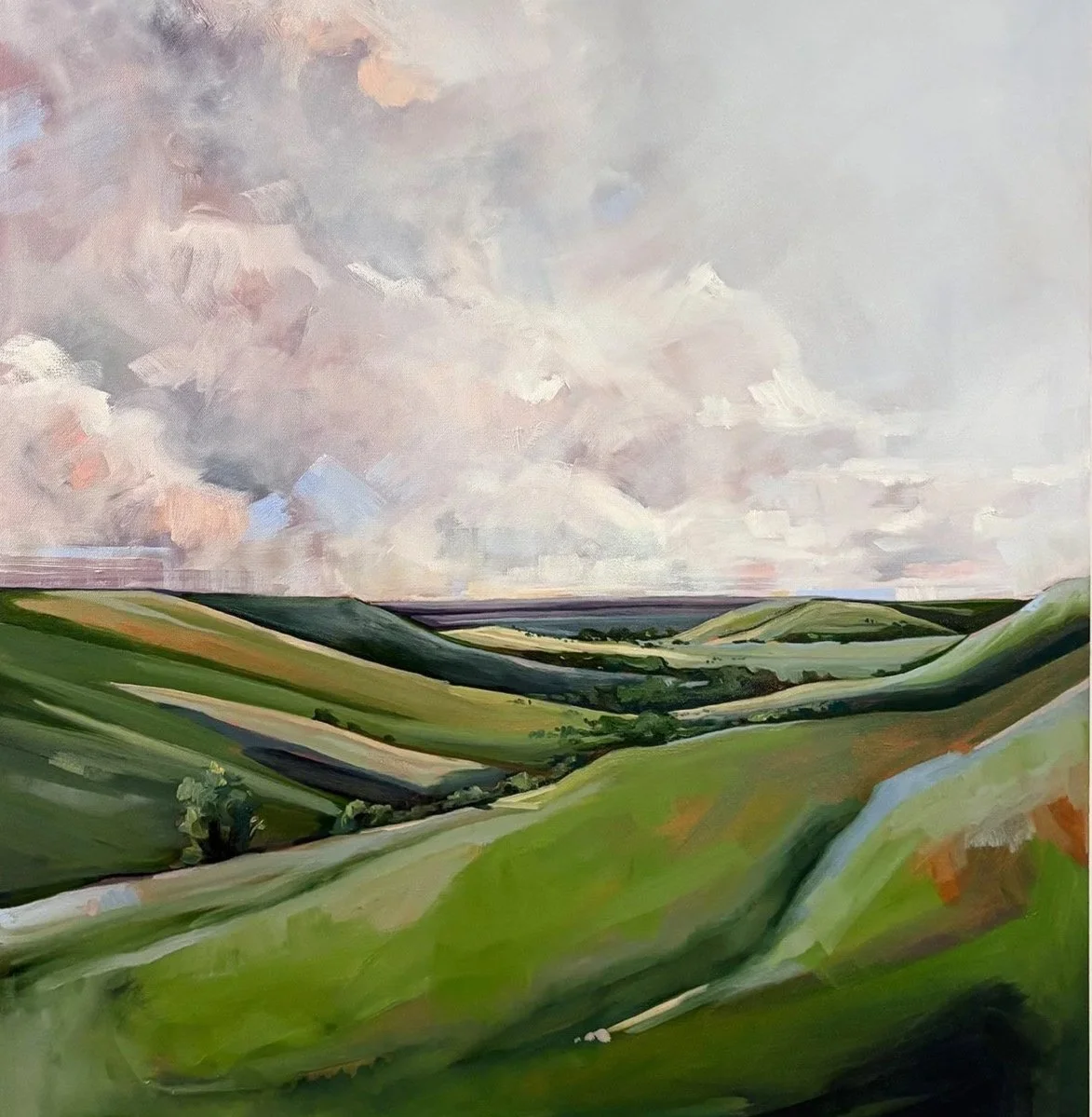 A landscape painting of rolling green hills under a cloudy sky.