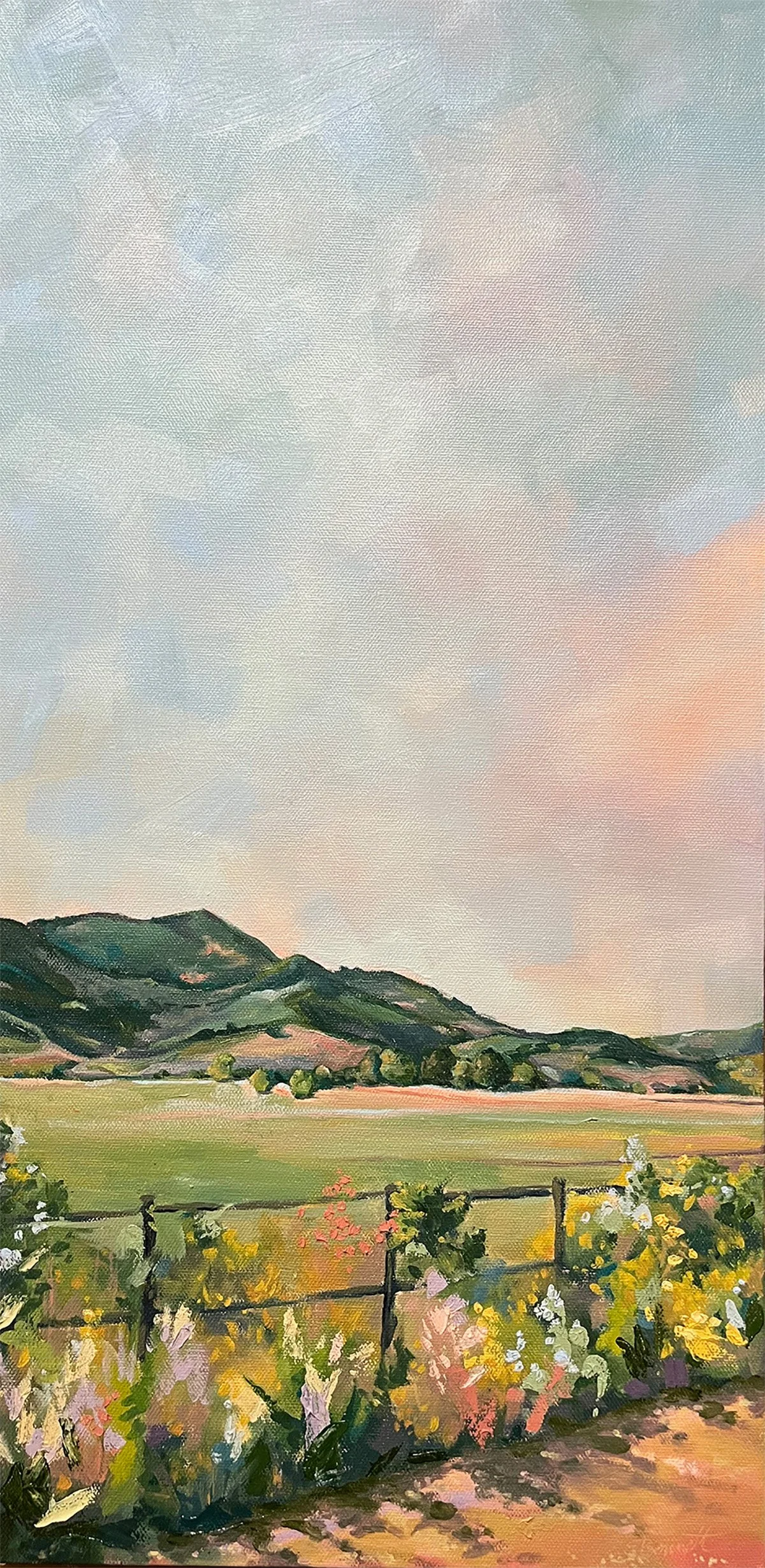 A landscape painting of mountains, grassy fields, and flowering plants under a pastel sky.