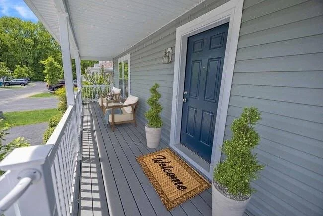 Welcoming front porch of a well-maintained rental property prepared for new tenants.