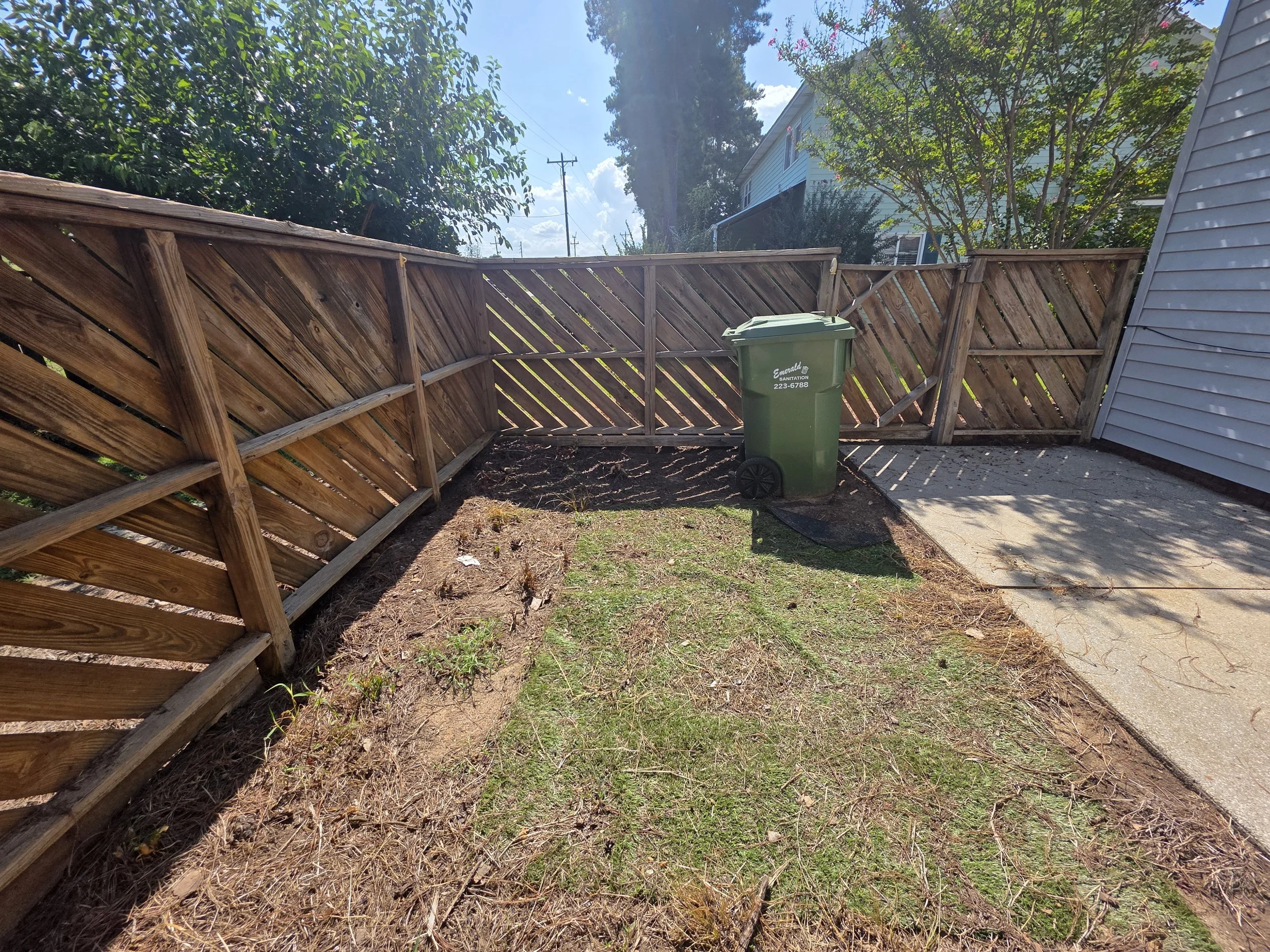 Private fenced patio and small outdoor area at 107 Country Village Ct, a townhouse for rent in Greenwood, SC