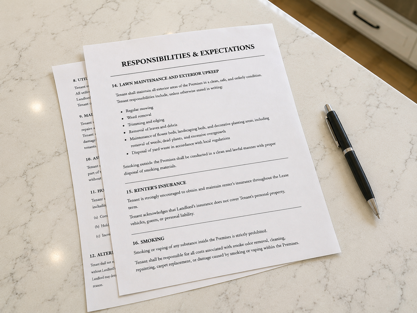 Rental lease outlining landlord and tenant responsibilities on a kitchen countertop, illustrating maintenance expectations and property care responsibilities for rental properties.