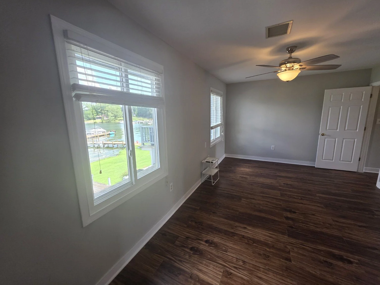 Bright bedroom with luxury flooring and views of Lake Greenwood at 112 Lake Ridge Drive