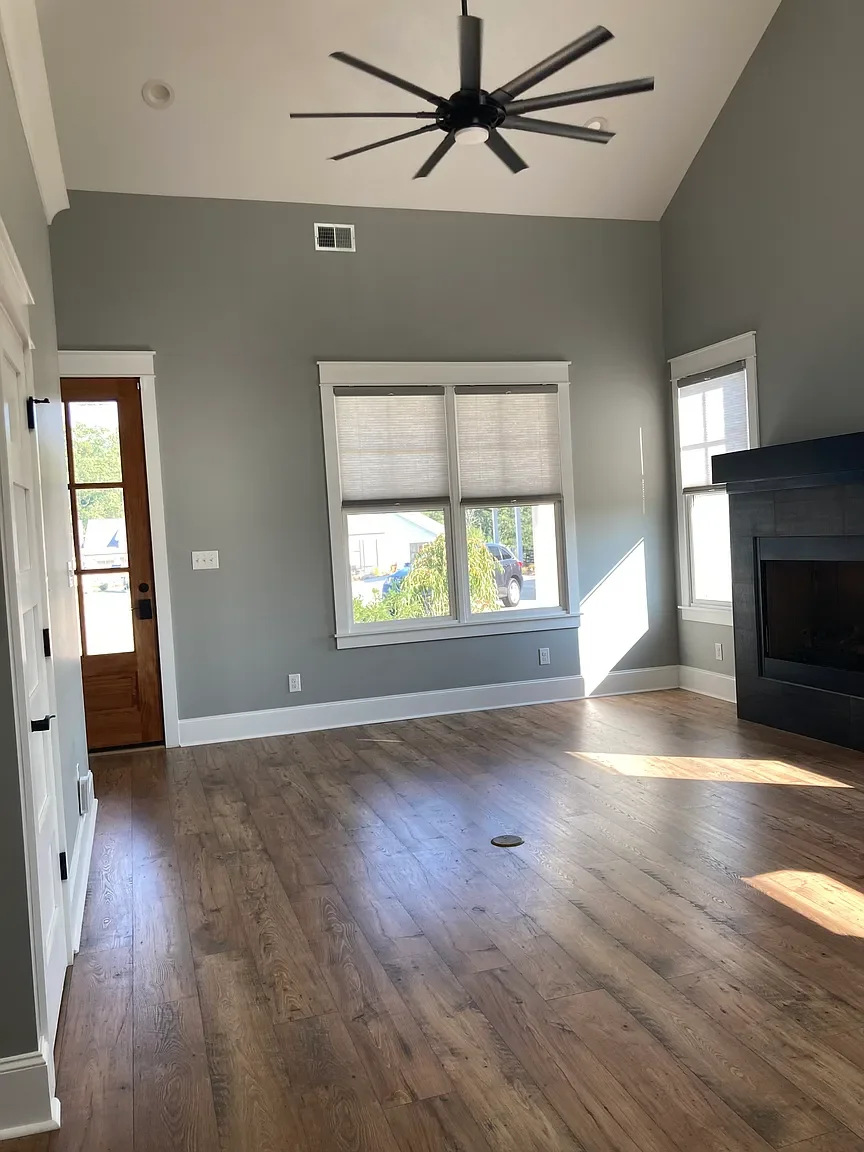 Vaulted living room with fireplace in Greenwood SC rental home.