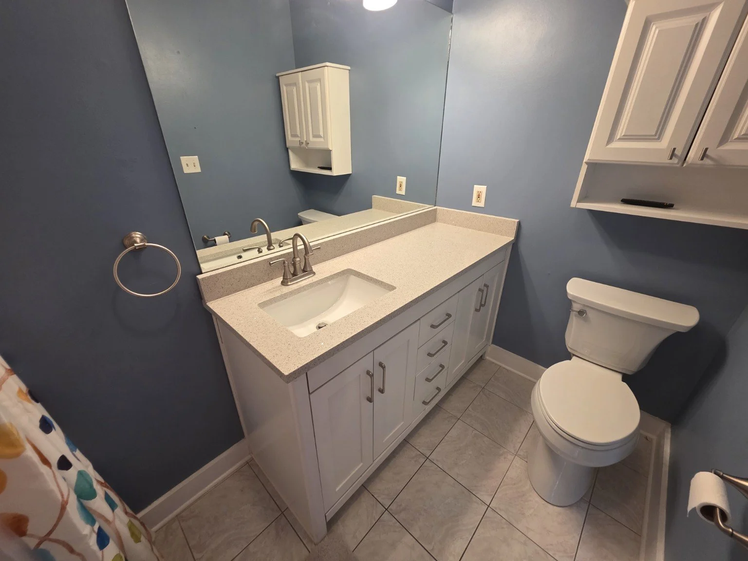 Updated bathroom with white vanity and modern finishes at 112 Lake Ridge Drive