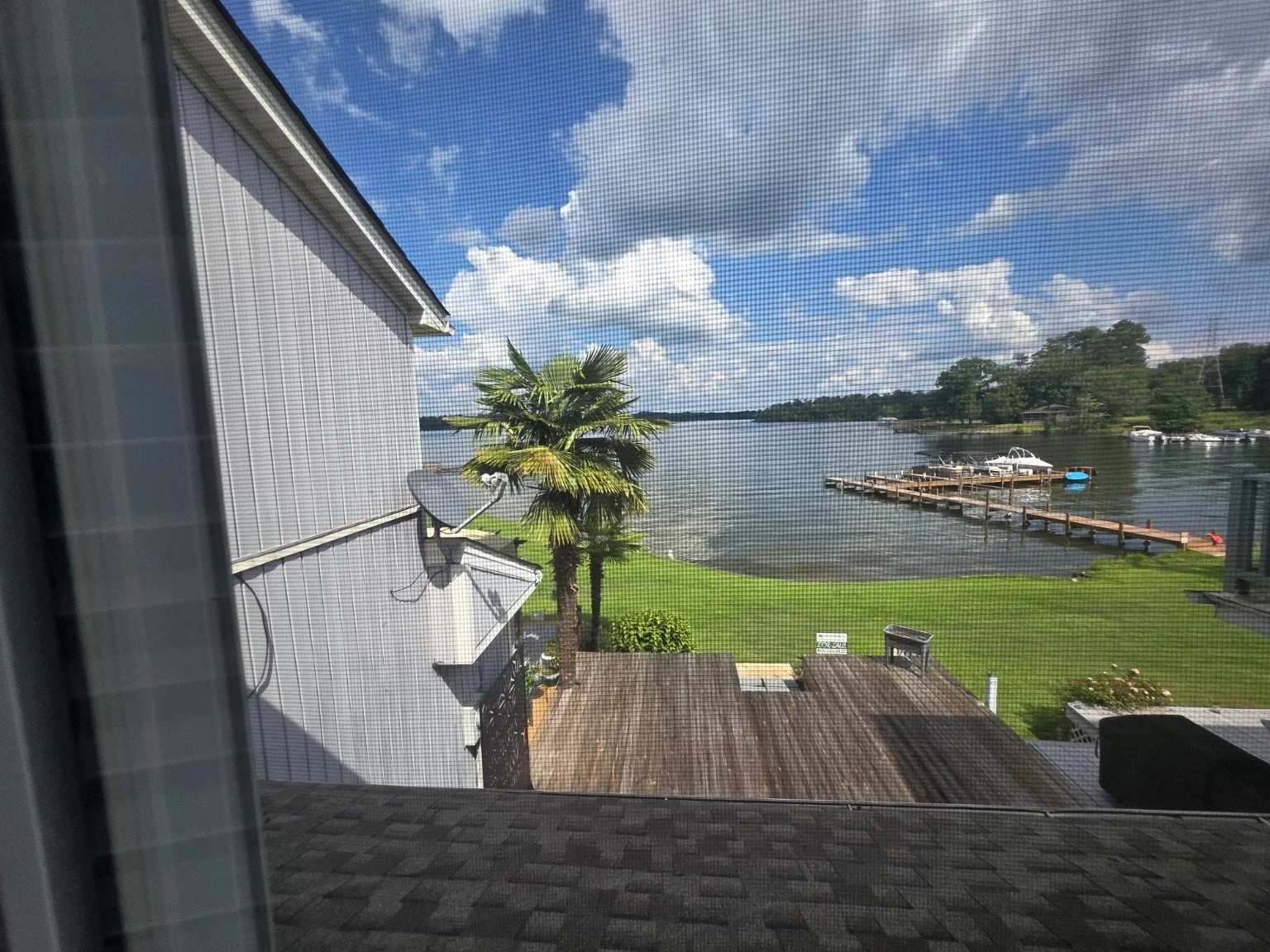 Lake Greenwood and boat dock view from a bedroom window at the Pier 96 townhome