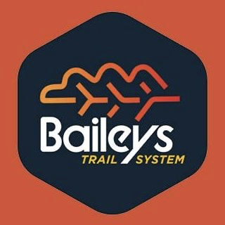 Baileys Trail System logo with a stylized mountain range and bicycle icon on an orange background.