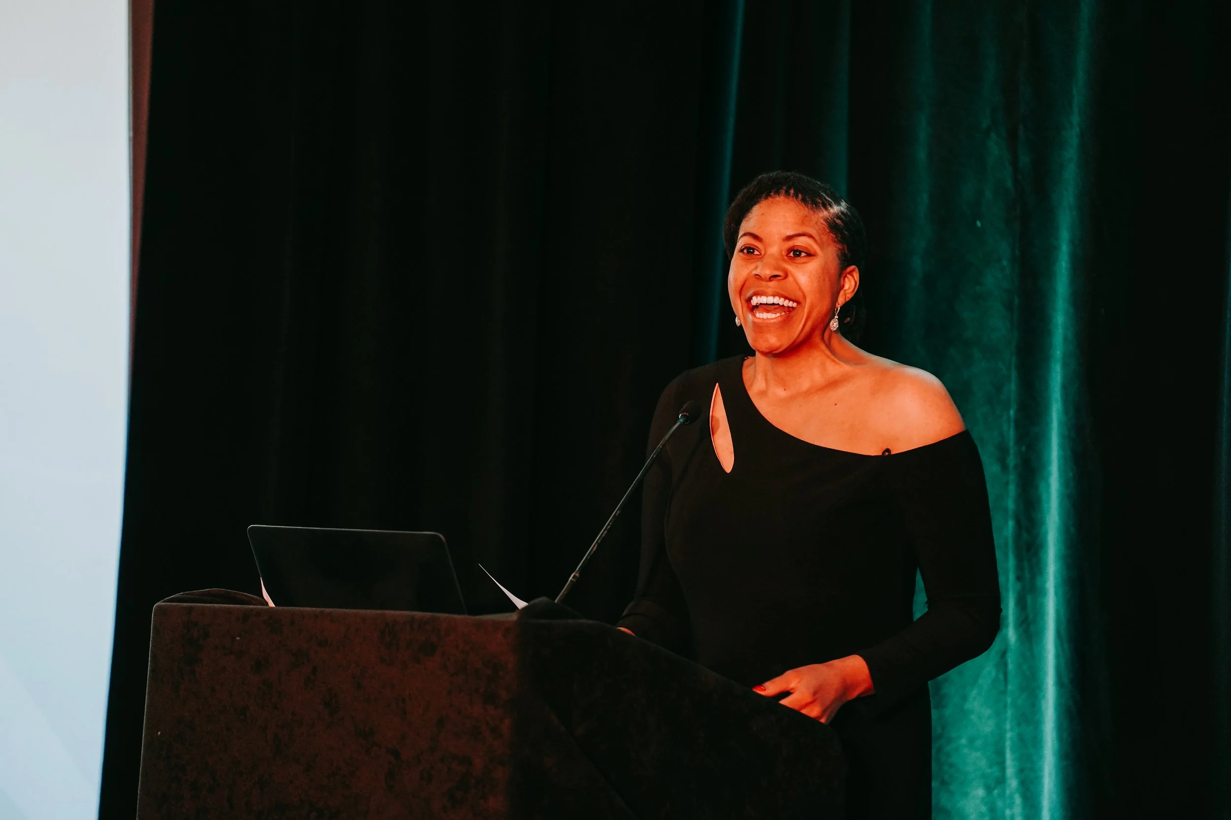 Ariana speaking at an event on advocacy, education, and support for the next generation
