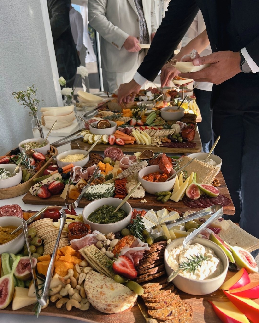 Luxury grazing table with artisan cheeses, charcuterie and premium local produce styled by Salt & Silk Collective for a wedding in Airlie Beach, Whitsundays.