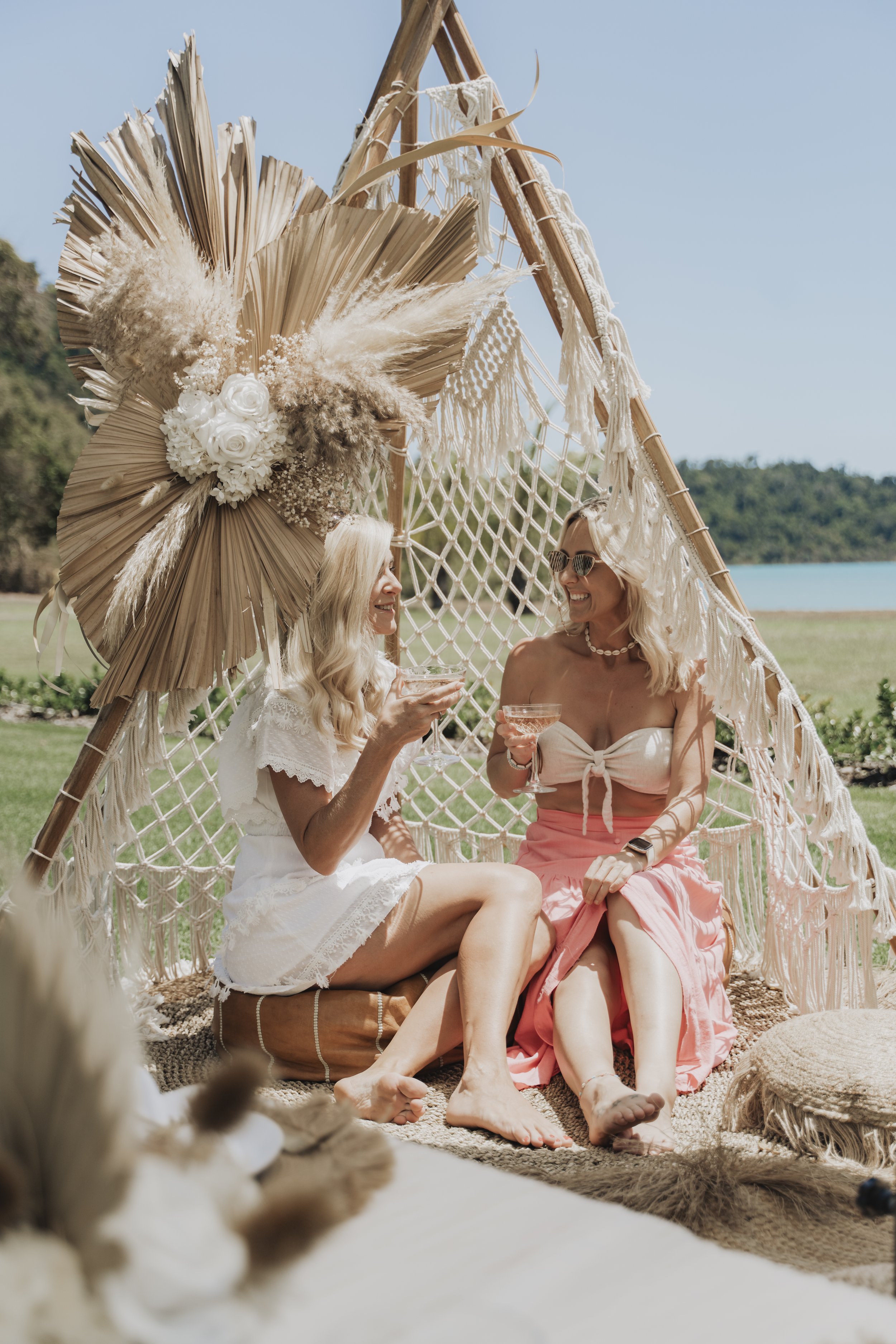 Luxury hens party picnic setup in Airlie Beach and the Whitsundays featuring boho coastal styling, picnic hire and celebration experiences by Salt & Silk Collective.