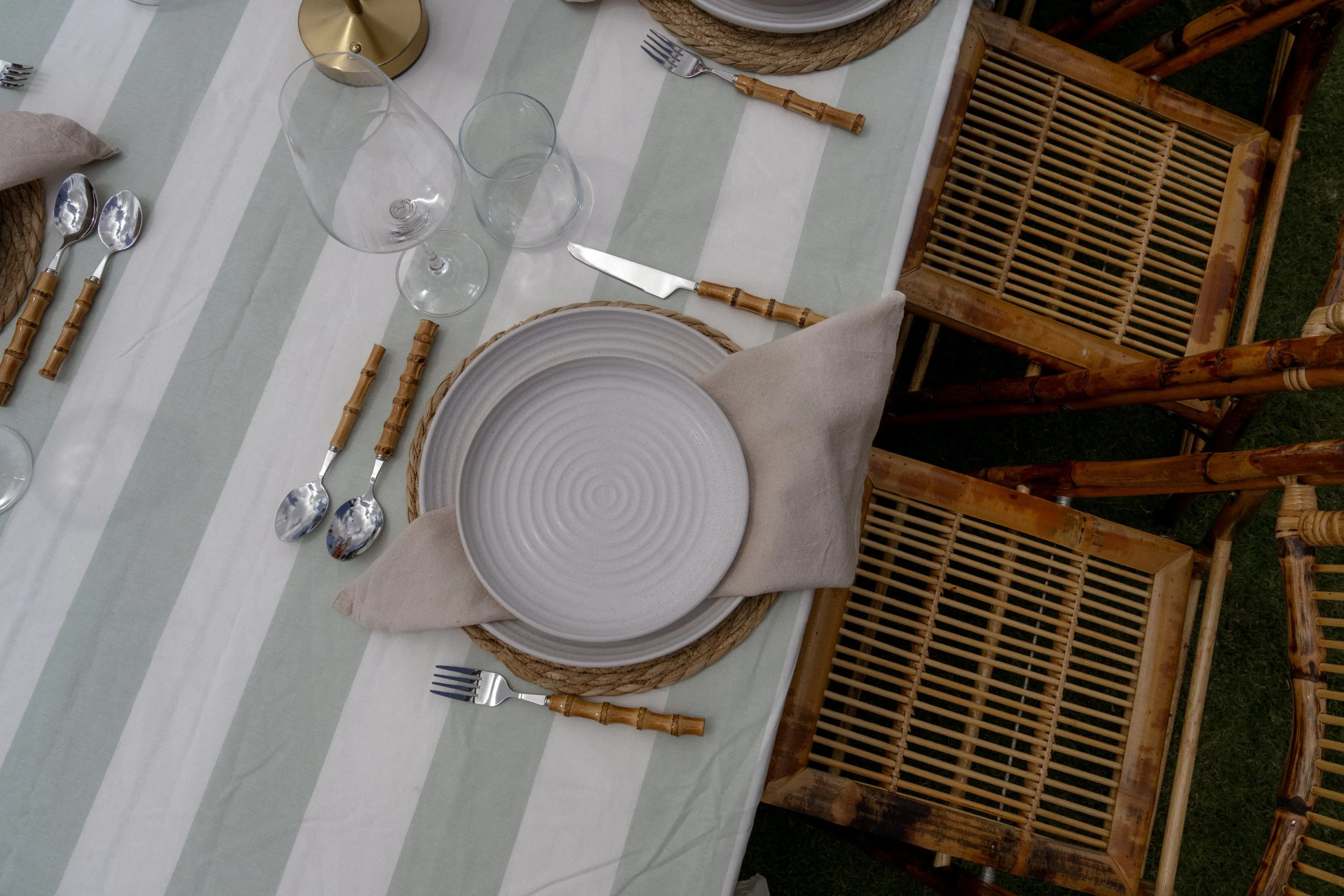 Luxury wedding table styling with neutral tablescape, bamboo cutlery and elegant place settings by Salt & Silk Collective in Airlie Beach, Whitsundays.