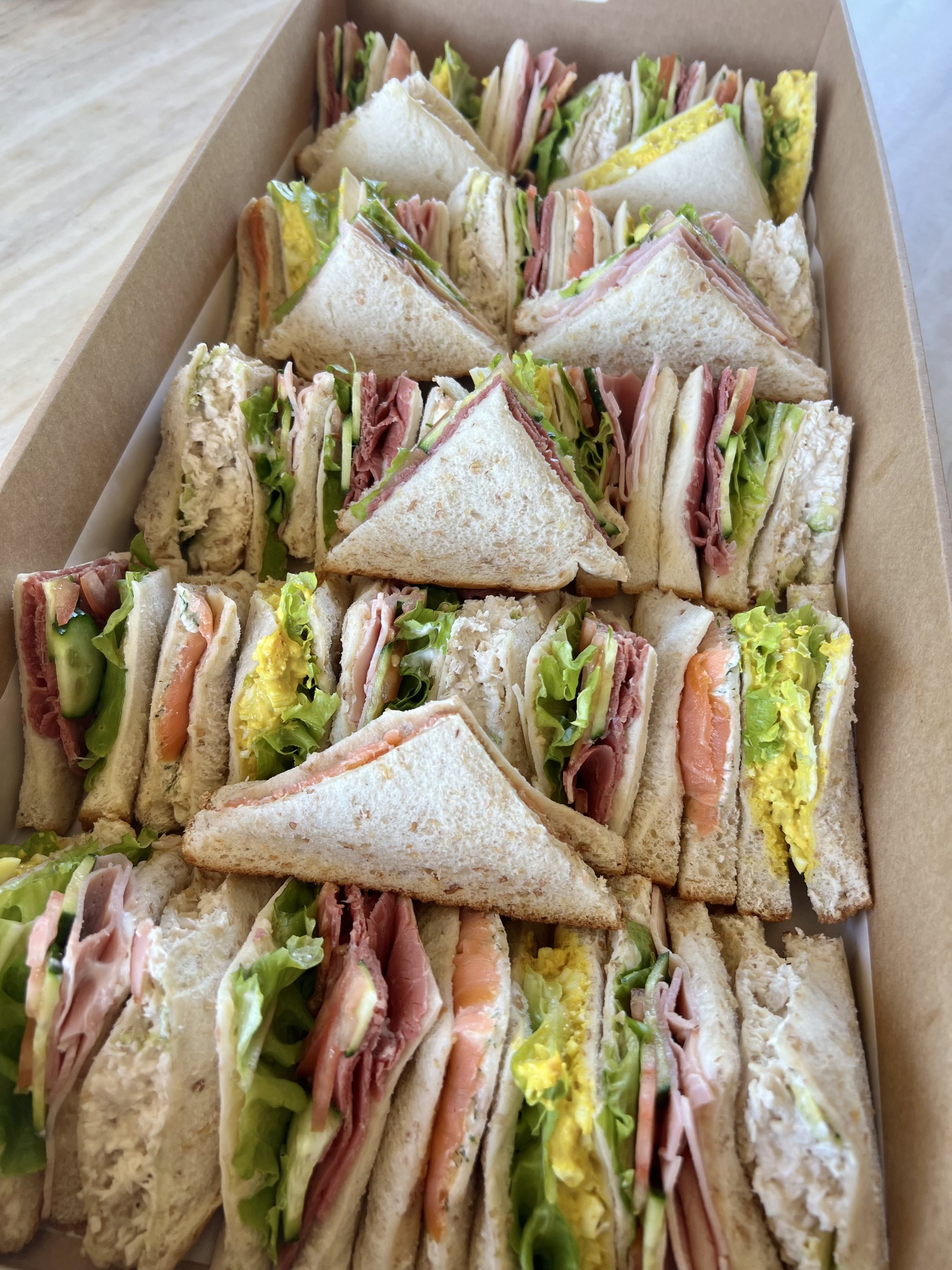 Fresh sandwich platter with gourmet fillings by Salt & Silk Collective, offering corporate catering, lunch boxes, grazing platters and event catering in Airlie Beach and the Whitsundays.