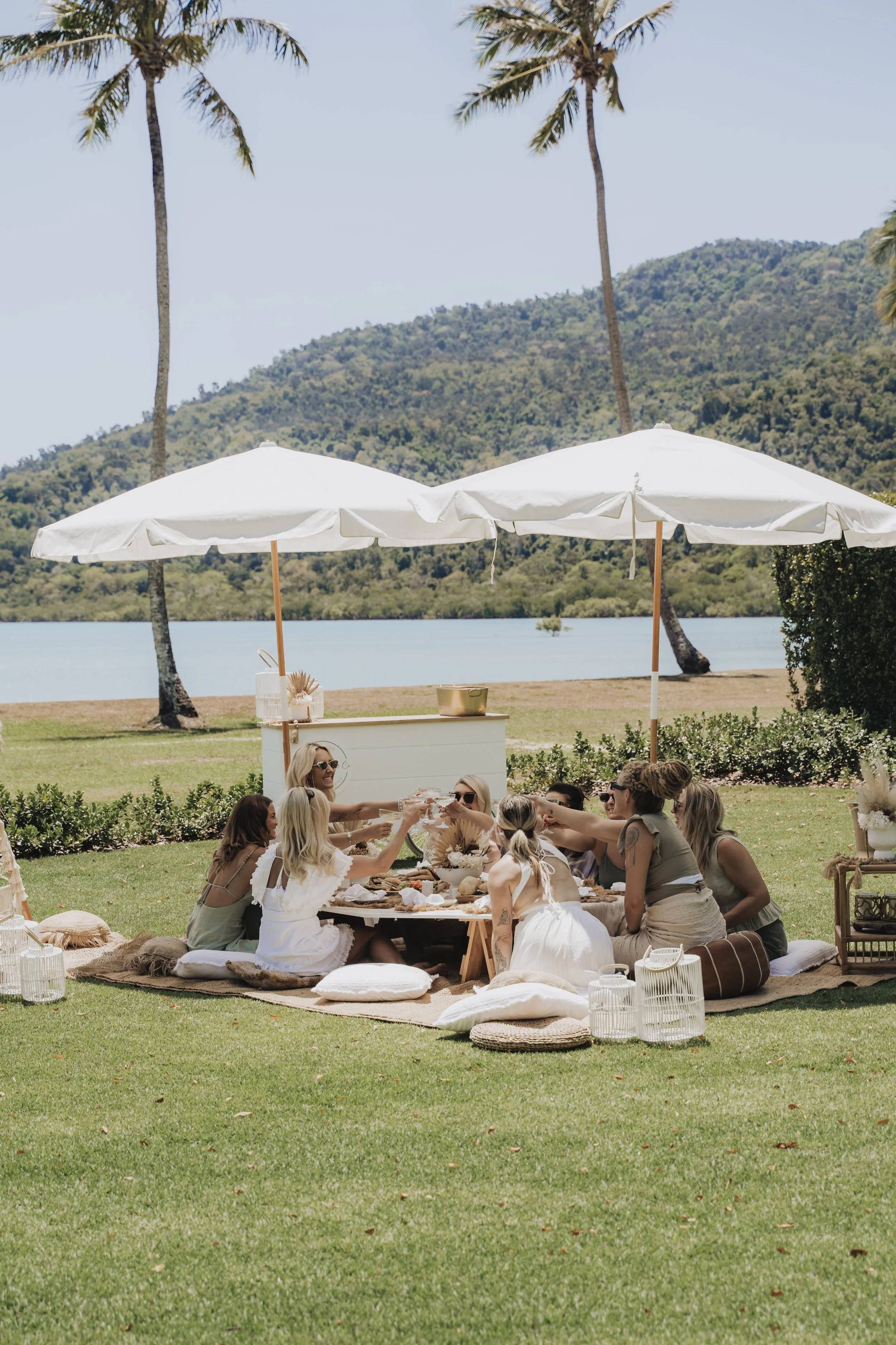 Luxury picnic experience in Airlie Beach and the Whitsundays by Salt & Silk Collective, featuring coastal picnic hire, grazing, hens parties and celebration styling.