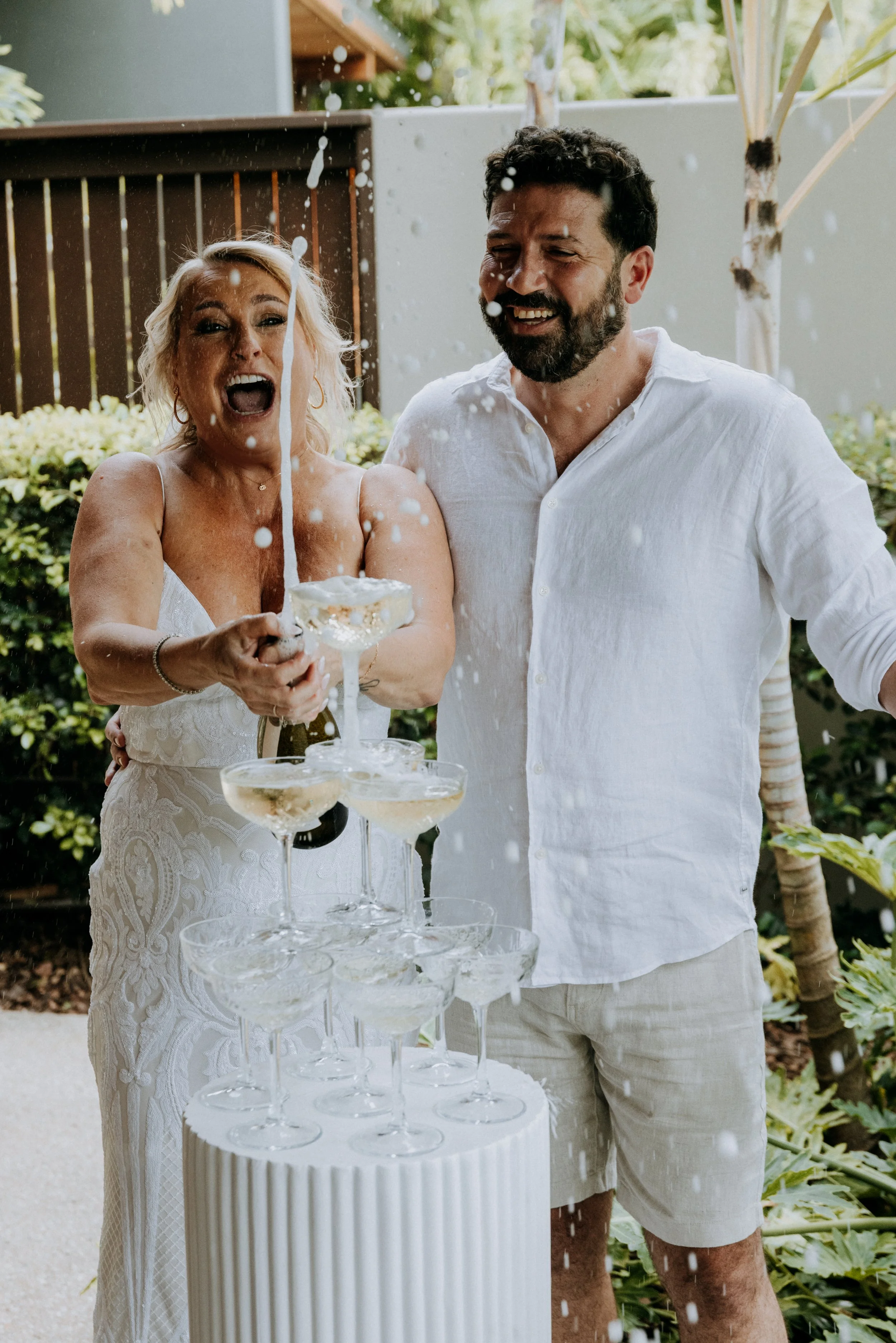 Champagne tower hire and luxury wedding reception styling for a coastal celebration in Airlie Beach, Whitsundays by Salt & Silk Collective.