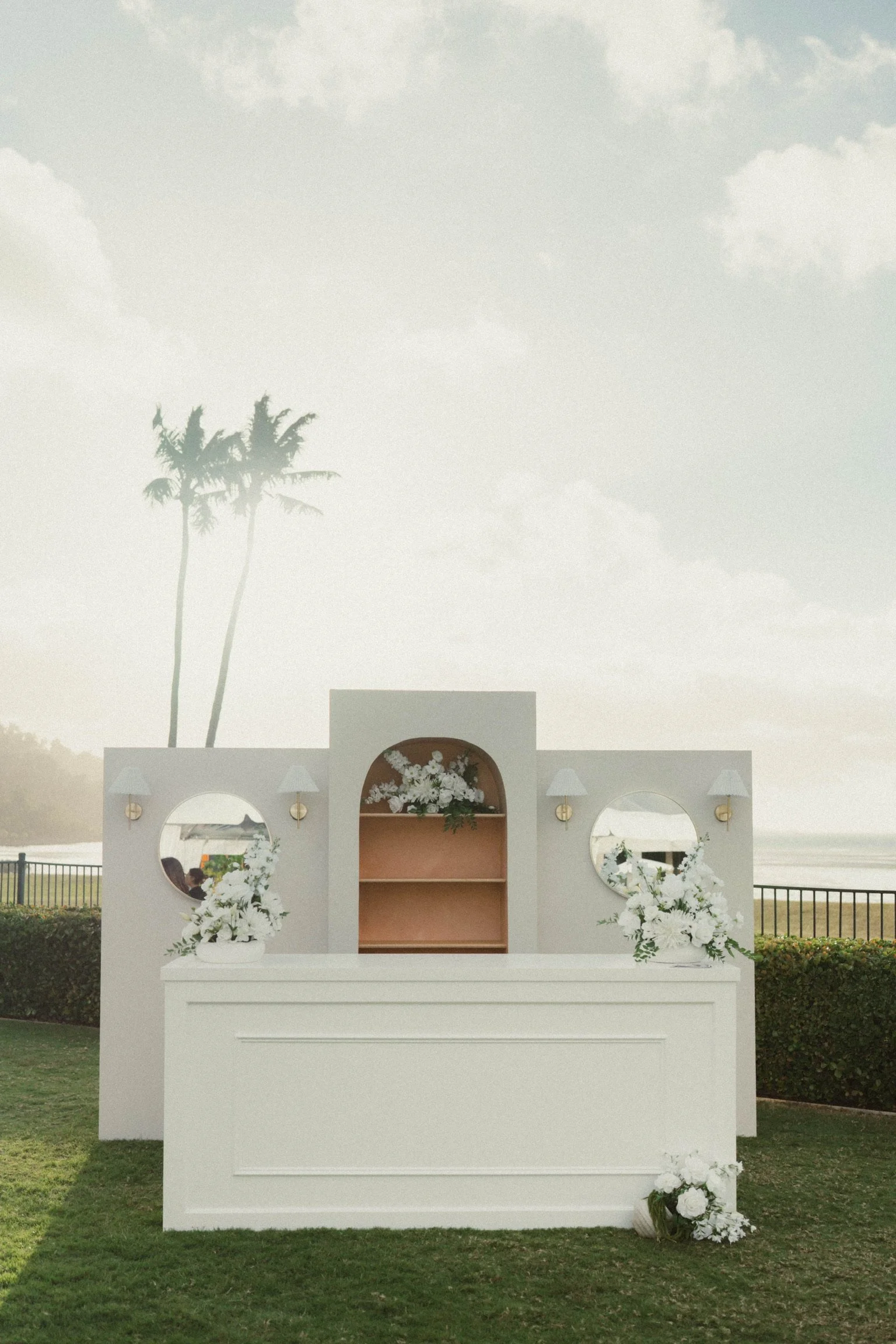 Luxury event hire by Salt & Silk Collective featuring a custom statement bar, shelving, florals and styling for weddings and celebrations in Airlie Beach and the Whitsundays.