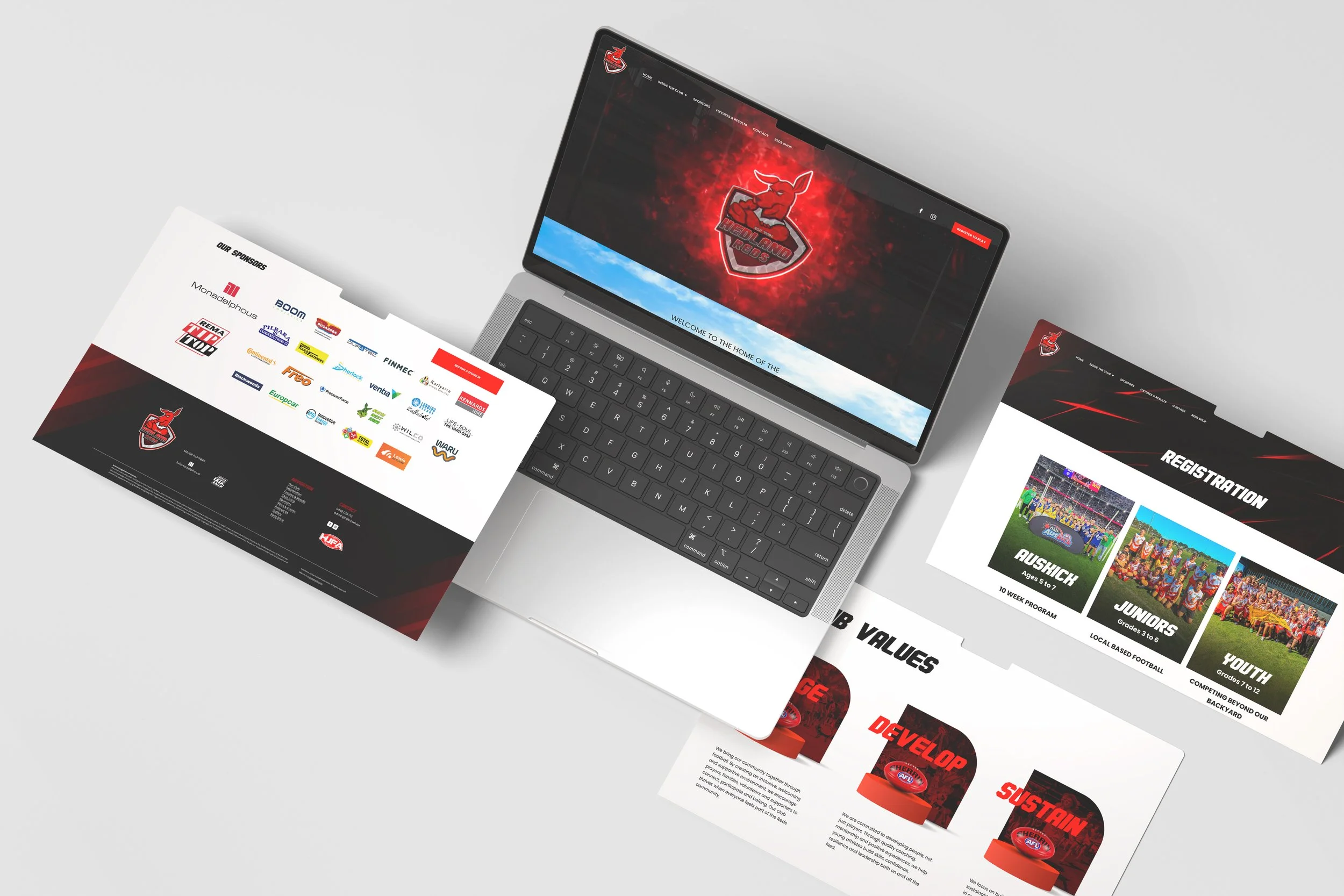Open laptop displaying a website for Hesdland Reds, featuring a red and black dragon logo. Screens and printed materials related to the Hesdland Reds team, including sponsorship logos, registration options, and youth program information, are also visible.
