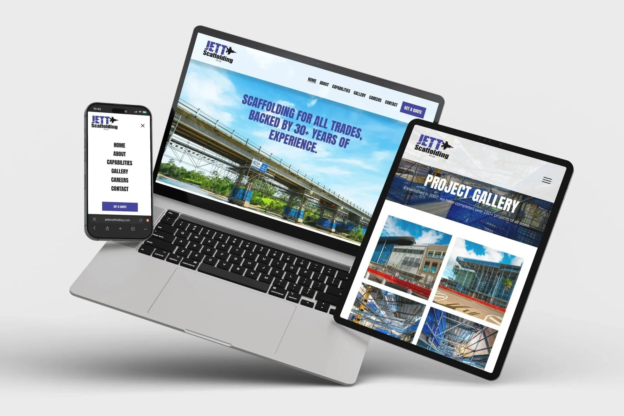 Multiple screens displaying the website of JETT Scaffolding, including a smartphone, tablet, and laptop, with images of construction scaffolding and infrastructure projects.