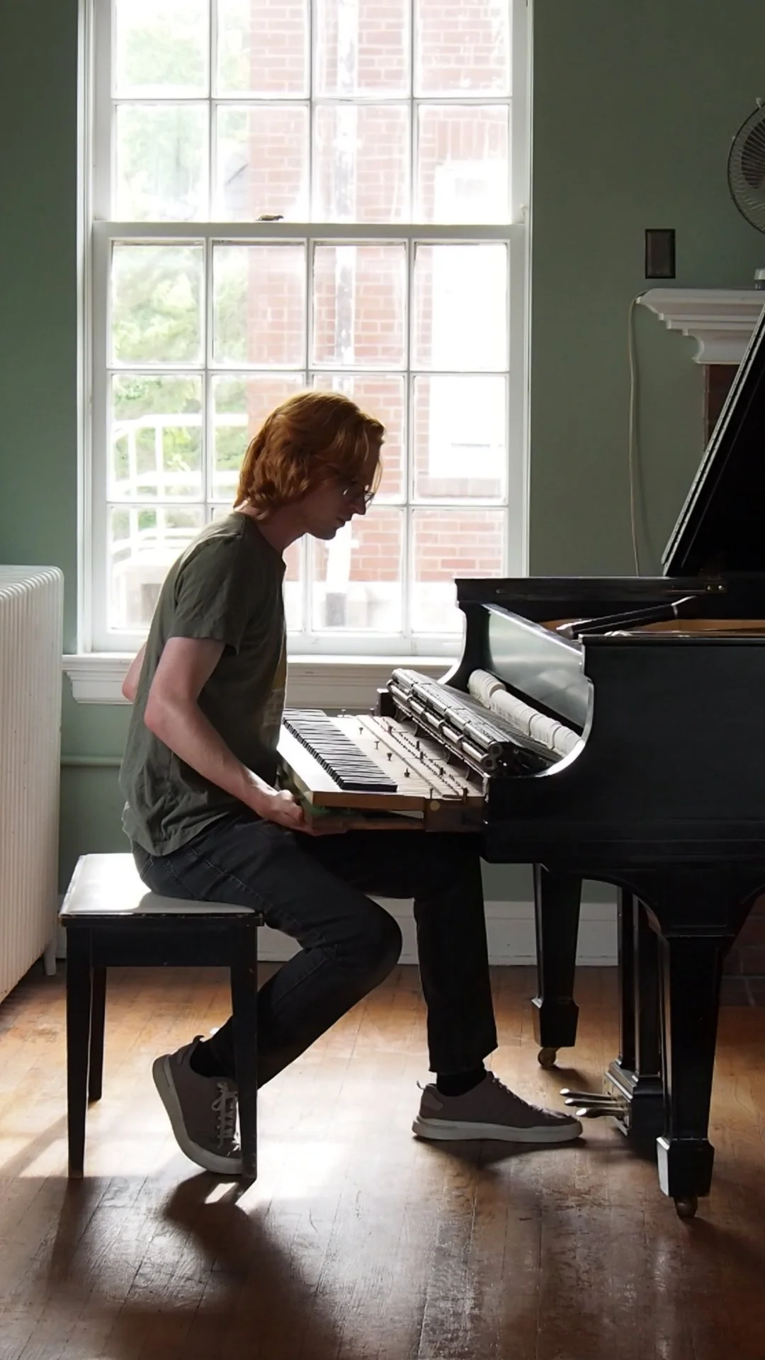 Brendan Coller removing the action from a Steinway grand piano