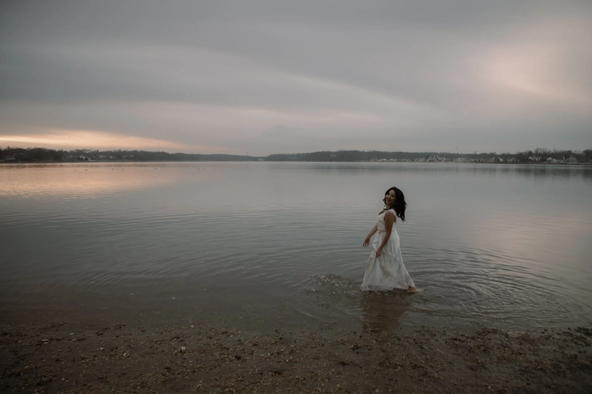 moody photoshoot woman walking in water