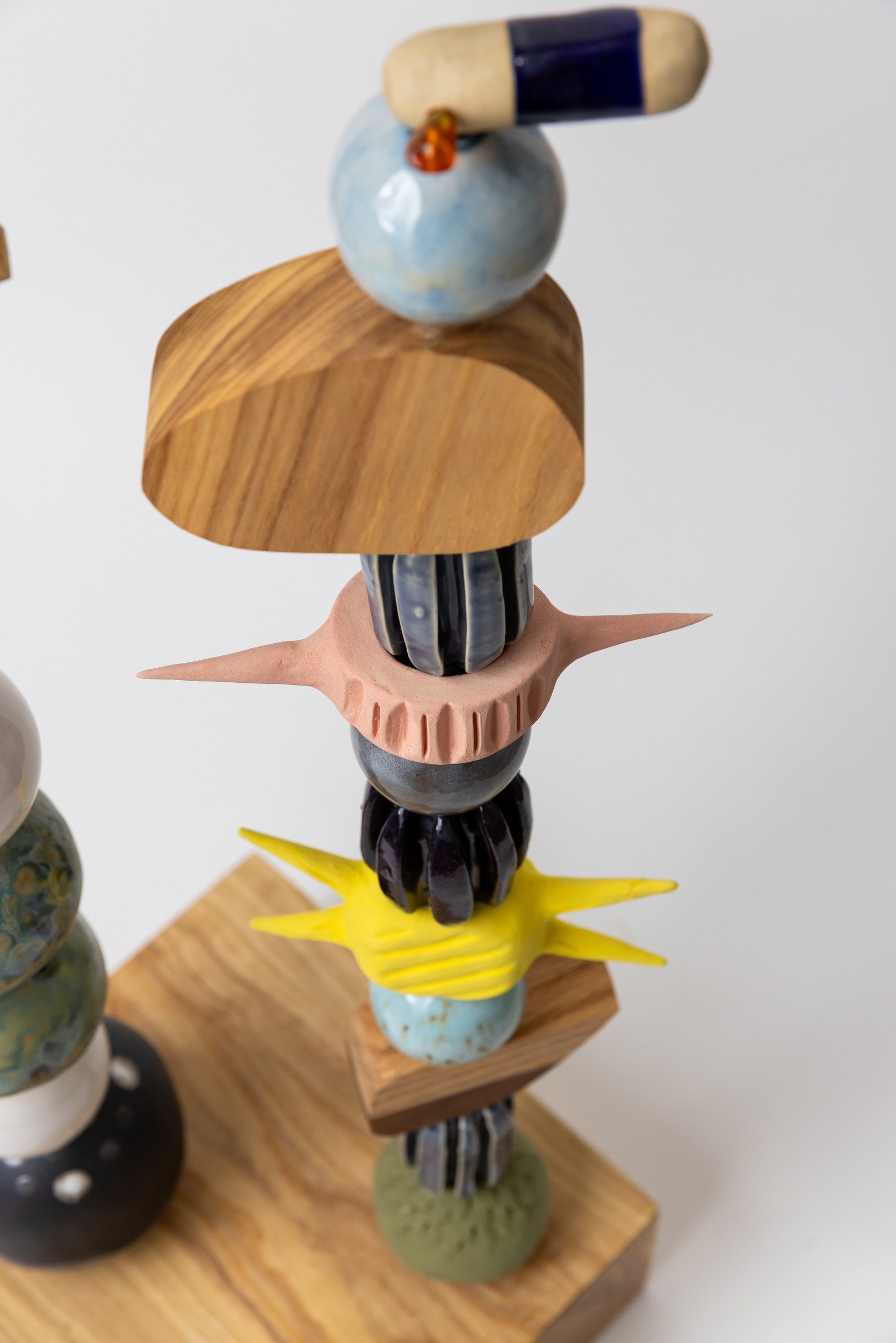 Totem No. 5 (TM005) — detail view 5   ·   Description: Totem No. 5 (TM005), one-of-a-kind ceramic and hand-carved wood totem sculpture by Brendan Bishop, Grip Fast Studio, Omaha — detail view 5.