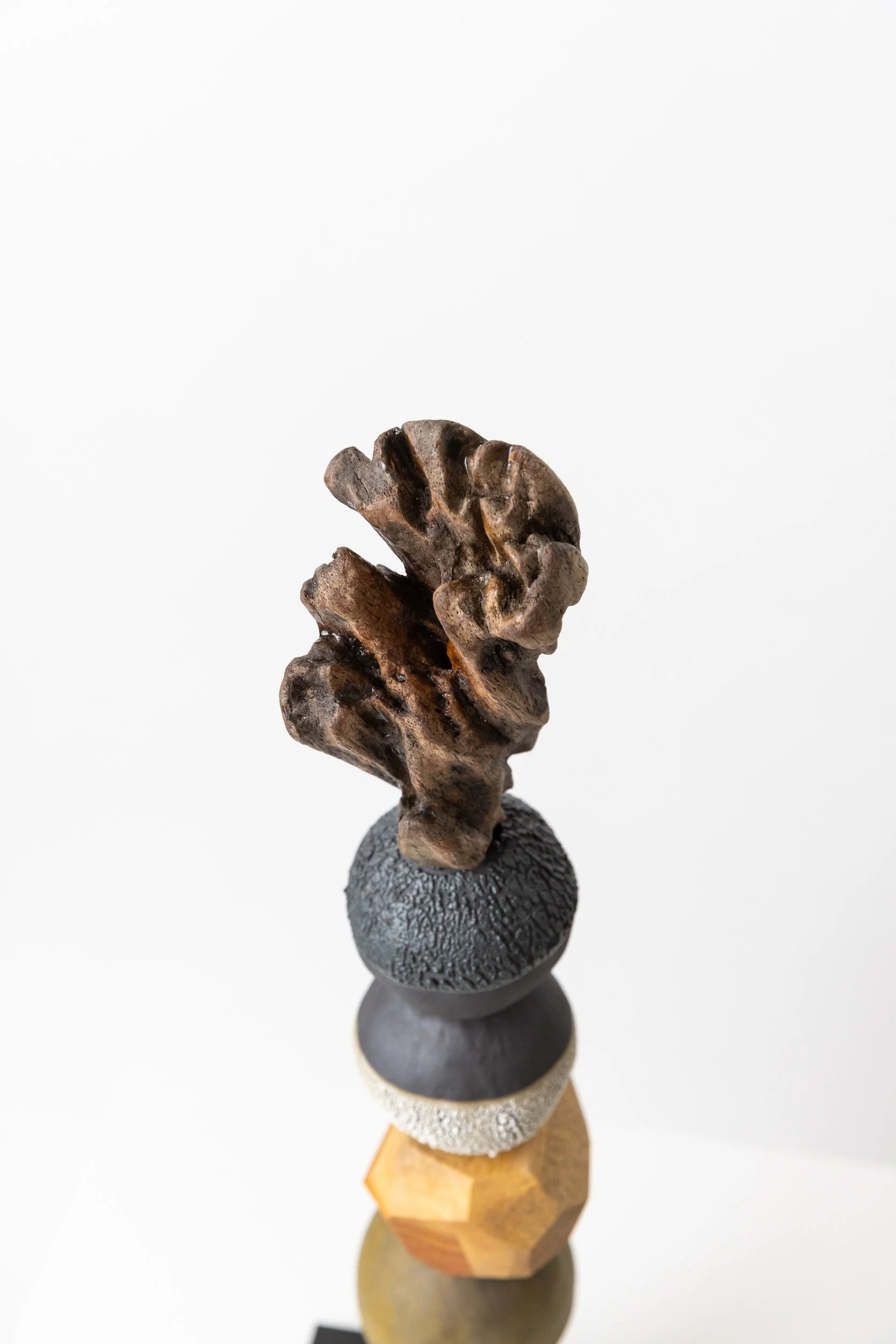 Totem No. 4 (TM004) — detail view 2   ·   Description: Totem No. 4 (TM004), one-of-a-kind ceramic and hand-carved wood totem sculpture by Brendan Bishop, Grip Fast Studio, Omaha — detail view 2.