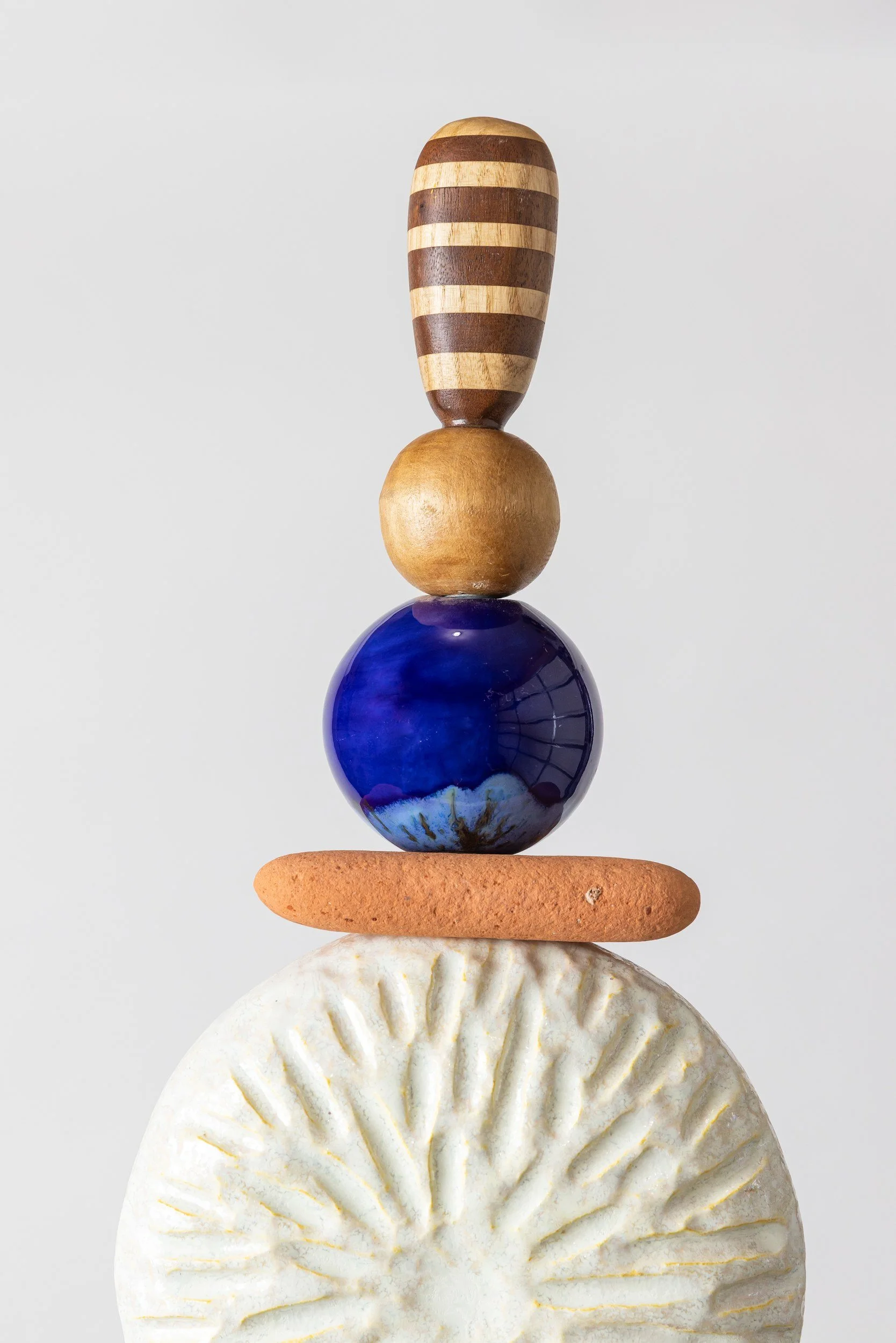 Totem No. 1 (TM001) — crown detail   ·   Description: Totem No. 1 (TM001), one-of-a-kind ceramic and hand-carved wood totem sculpture by Brendan Bishop, Grip Fast Studio, Omaha — crown detail.