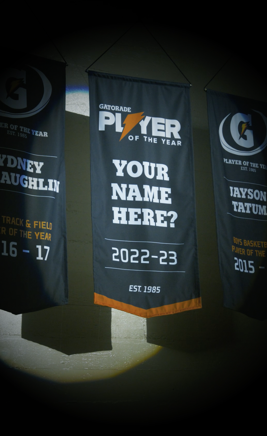 A sports banner with the Gatorade logo, text reading 'Player of the Year', and space for a player’s name and the season 2022-23. Other banners listed are for Sidney Laughlin and Jayson Tatum.