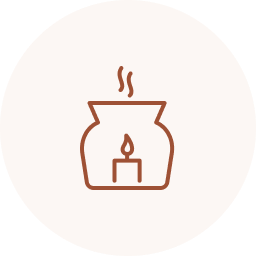 A candle inside a ceramic holder with a flame, emitting steam or heat waves.