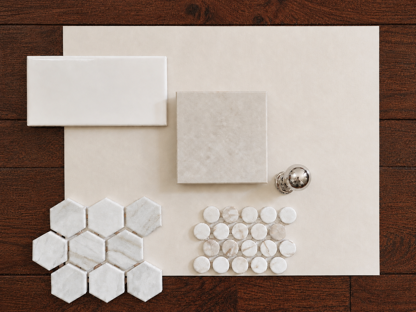 Various white marble tiles and fixtures arranged on a white background for a tile selection or design layout.