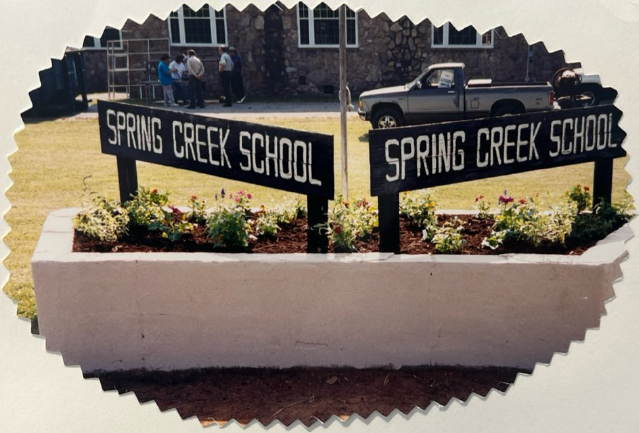 The School Sign circa 2002, with plain concrete block planter.