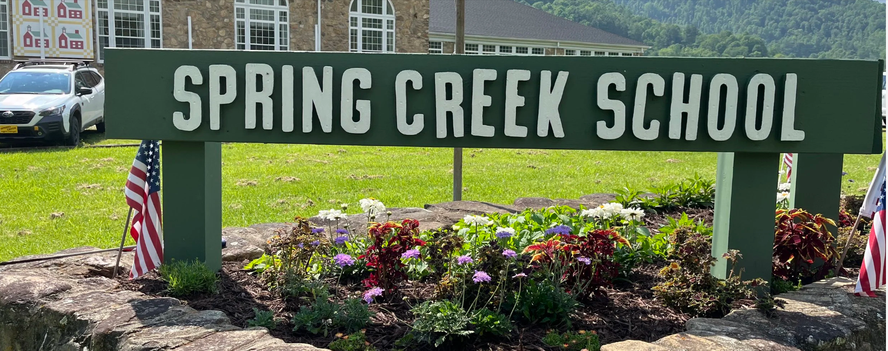 The Spring Creek School Sign from 2006 was rotting and falling apart, so volunteers refreshed it in 2025, maintaining its original spirit.