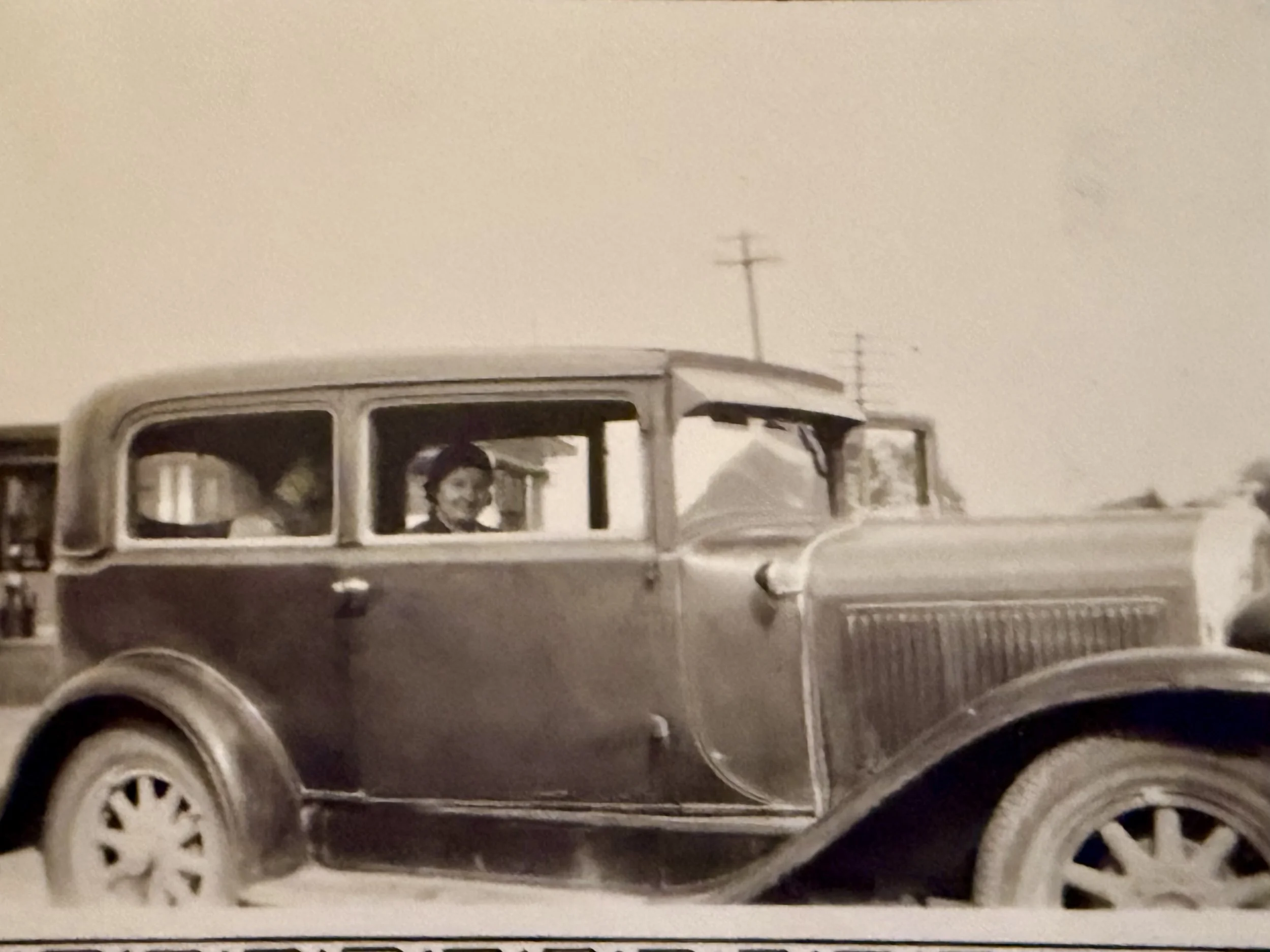 woman in vintage car