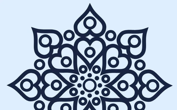 A symmetrical black and blue mandala design with heart and circle patterns on a light blue background.