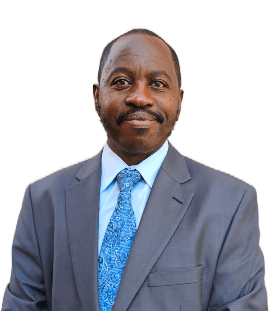 Portrait of a man in a gray suit with a blue patterned tie, white shirt, and a slight smile, against a white background.