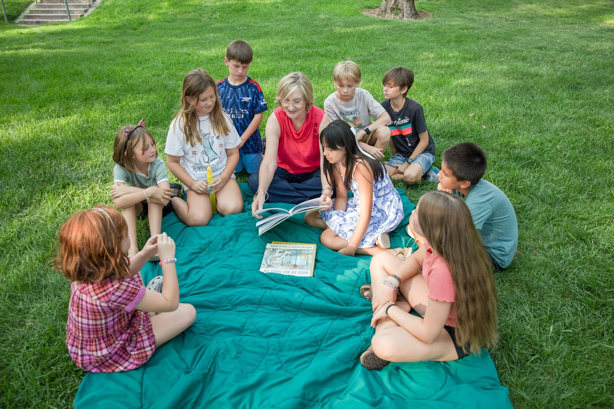 Debra Brady reading to children.