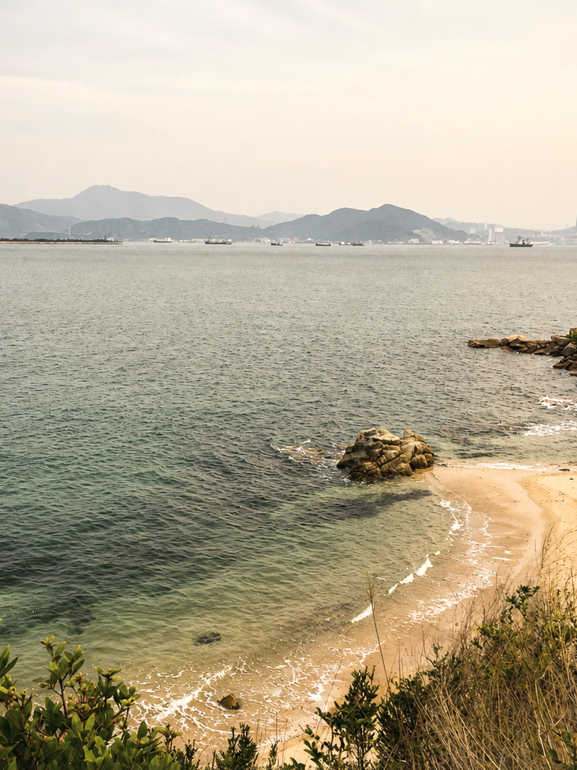 Peaceful coastal shoreline with calm water and distant mountains, symbolizing hope, healing, and renewed perspective after depression.